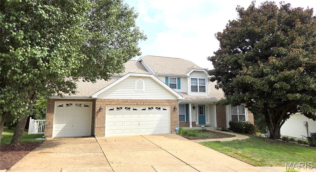 Beautifully maintained 1.5-story home located in the highly desirable Rockwood School District and just minutes from Gravois Bluffs shopping, dining, and entertainment. The inviting foyer features an open staircase, abundant closet space, 1/2 bath, opens to the formal living room with vaulted ceiling and separate formal dining room. The stunning two-story great room showcases floor-to-ceiling windows, a gas fireplace, and breathtaking views of the private wooded backyard.  
     The spacious kitchen offers custom cabinetry, center island with seating, a large breakfast room with access to the expansive deck overlooking the fenced backyard.  The main-floor primary suite features vaulted ceilings, a large luxury ensuite with vaulted ceiling, walk-in closet, dual vanities, soaking tub, and oversized separate shower. Main-floor laundry and an oversized 3-car garage add convenience. 
     Upstairs, you'll find an open loft, three generously sized bedrooms with ample closet space, and a full bath with separate tub and shower. The partially finished walkout lower level offers exceptional versatility with a gas fireplace, recreation room, dining area, full bath, additional living space, storage, and utility rooms, making it ideal for entertaining, guests, or potential in-law quarters. 
     Enjoy your own private backyard oasis featuring a large deck, spacious patio, mature landscaping, charming sitting areas, walkways, fenced yard, oversized lot, and an in-ground sprinkler system. Move-in ready and includes a home warranty. A rare opportunity to own a spacious home with exceptional indoor and outdoor living spaces in a prime location.