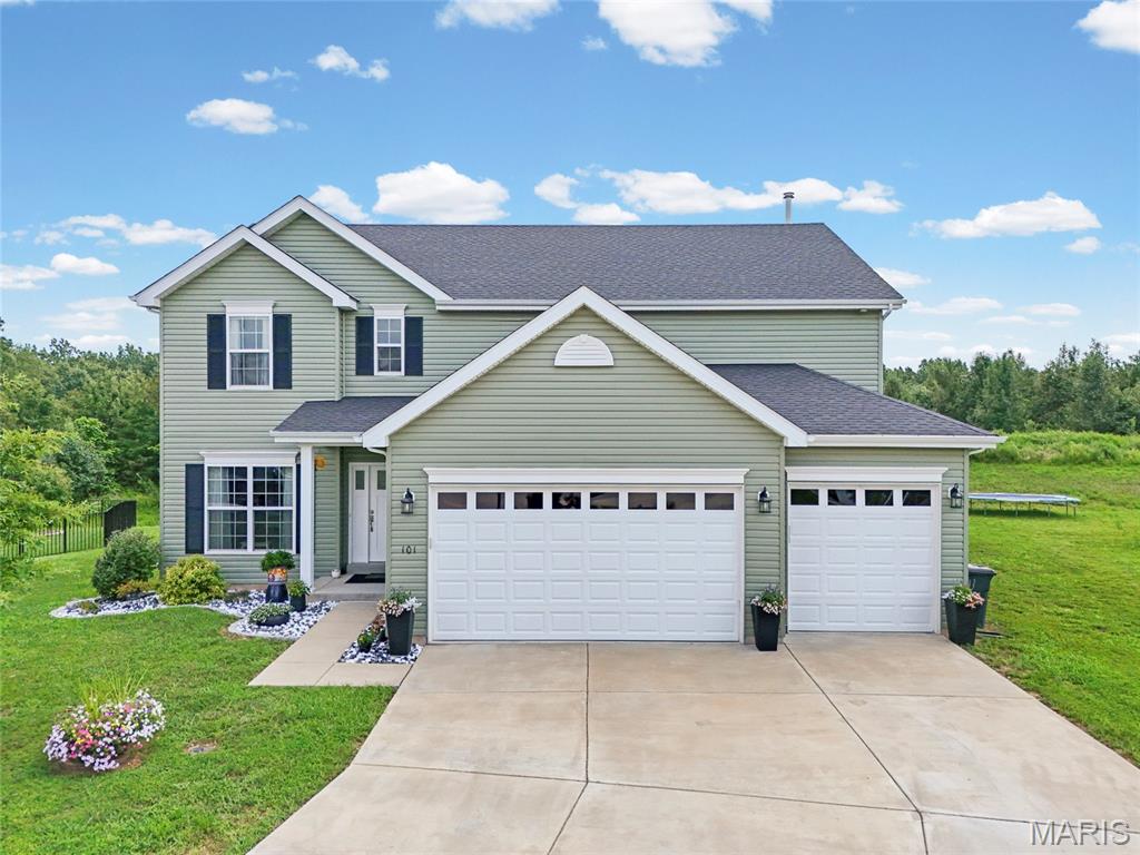 Welcome to this stunning two-story home, built in 2021, offering the perfect blend of modern design, spacious living, and an unbeatable location. Featuring 5 bedrooms, 4.5 bathrooms, a finished lower level, and a 3-car garage, this home is located in the highly sought-after Seckman School District and is just minutes from schools, shopping, dining, and convenient highway access. The open-concept main level is thoughtfully designed for both everyday living and entertaining, featuring a private home office, formal dining room, spacious living room with a cozy gas fireplace, and a beautifully appointed kitchen. The kitchen boasts 42-inch cabinetry, stainless steel appliances, a walk-in pantry, abundant cabinet and counter space, and a bright breakfast room overlooking the backyard. Step outside and enjoy your own private outdoor retreat! The impressive 40' x 20' patio with a 16' x 20' lean-to provides the perfect space for relaxing, entertaining, or hosting gatherings year-round. Backing to common ground and mature trees, the backyard offers a peaceful setting with added privacy. Upstairs, the oversized primary suite serves as a luxurious retreat, complete with a soaking tub, separate shower, double vanity, and a spacious walk-in closet. A versatile loft offers additional living space, while three generously sized bedrooms and a full hall bath complete the upper level. The finished lower level adds even more functional living space with a large family room, fifth bedroom, full bathroom, and ample storage. If you've been searching for a move-in-ready home with exceptional space, thoughtful design, modern finishes, and room for everyone, this home truly has it all. Don't miss the opportunity to make this incredible home yours!