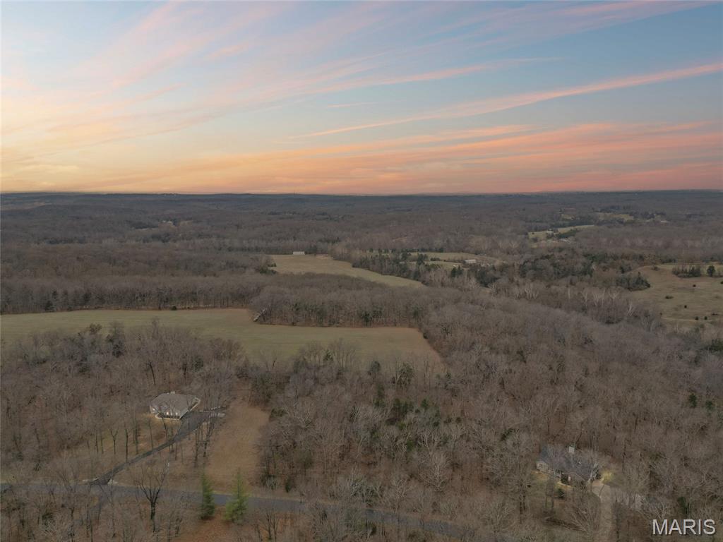 Build your dream home on this beautiful 3-acre homesite tucked away on a quiet no-outlet street. The property features level to gently rolling terrain, offering a mix of mature woods and a cleared area that’s ideal for your future home site. Enjoy privacy, space, and a peaceful setting just minutes from nature, located less than 1.5 miles from Don Robinson State Park and near Cedar Hill Fire Protection District Station 3. Electric service has already been run to the lot, helping simplify the building process. Situated in the desirable Crown Hill Subdivision, the property is subject to HOA covenants and restrictions, with home plans and specifications requiring prior approval by the Trustees. Buyers may bring their own custom plans or take advantage of seller-provided home drawings that meet all HOA requirements, while still allowing flexibility to customize interior finishes. A rare opportunity to build in a serene, established setting. Don’t miss your chance to make this property your own!