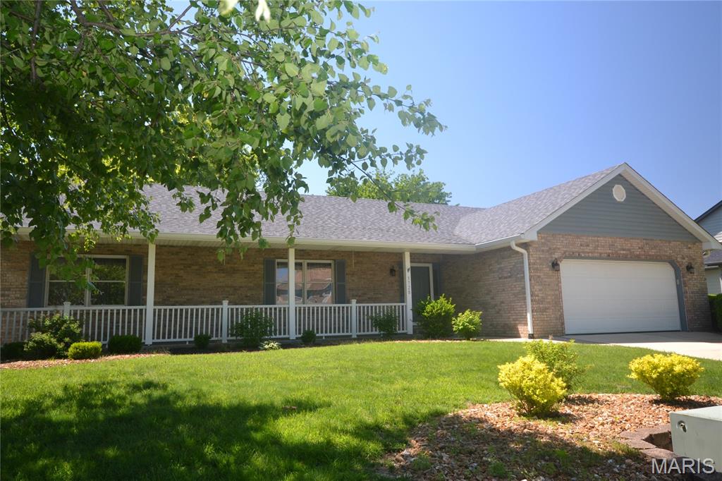 Conveniently located approximately 10 minutes from Scott Air Force Base, Memorial Hospital, shopping, restaurants, and interstate access this Beautifully maintained 3 bedroom, 2.5 bath home is move-in ready. With extensive hardwood flooring throughout the main living areas, including the Foyer, Great Room, Dining Room, Breakfast Room, Kitchen, Laundry Room, Half Bath, and Primary Bedroom. Secondary bedrooms offer new carpeting.

The remodeled kitchen offers new cabinetry, granite countertops, soft-close drawers, pull-out shelving, and stainless steel appliances. The bayed Breakfast Room includes a sliding glass door leading to a large composite deck with maintenance-free white fencing and a backyard that backs to an open field.

Great Room features a cathedral ceiling, ceiling fan, and brick gas fireplace. Dining Room includes a tray ceiling and hardwood floors. The bedroom/office off the Great Room has French doors, new carpet, and a ceiling fan. Full hall bath includes a tub/shower combo and linen closet.

The Primary Suite offers a cathedral ceiling, hardwood floors, walk-in closet, and a private bath with jetted tub, separate shower, and double sinks.

The unfinished basement provides excellent potential with two egress windows, a fireplace, and plumbing rough-in for a future bath. High-efficiency furnace. Attached two-car garage. Conveniently located approximately 10 minutes from Scott Air Force Base, Memorial Hospital, shopping, restaurants, and interstate access.