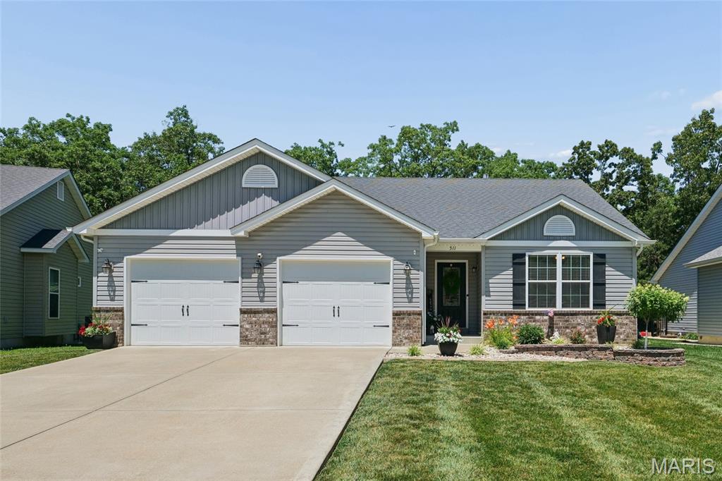 Welcome to this impressively updated 4-bedroom, 3-bath home, where refined finishes and thoughtful enhancements create an exceptional living experience. Freshly painted and move-in ready, the home features elegant luxury vinyl plank flooring, soaring vaulted ceilings in the great room, and blinds throughout. The beautifully appointed kitchen showcases upgraded cabinetry, an added pantry cabinet, striking quartz countertops, reverse osmosis water filtration, and includes a refrigerator (as-is) for effortless everyday living. The spacious primary suite offers a luxurious private retreat, highlighted by a custom feature wall, accent lighting, dual vanities, a walk-in shower, and an expansive walk-in closet. Generously sized secondary bedrooms provide comfort and ample storage space. The finished lower level is designed for both relaxation and entertaining, while the fourth bedroom and full bath offer ideal accommodations for guests or a sophisticated home office. Additional premium features include a Culligan whole-house water filtration system, water softener, Ring security system, insulated oversized two-car garage, and black aluminum fencing surrounding the backyard. New landscaping adds to the home’s impressive curb appeal and creates inviting outdoor spaces to enjoy. There are also 3 beautiful lakes for your outdoor enjoyment where you can kayak, paddleboard and fish! Blending upscale features, versatile living areas, and desirable amenities, this exceptional property offers the perfect balance of comfort, style, and modern convenience. Schedule your private showing today!