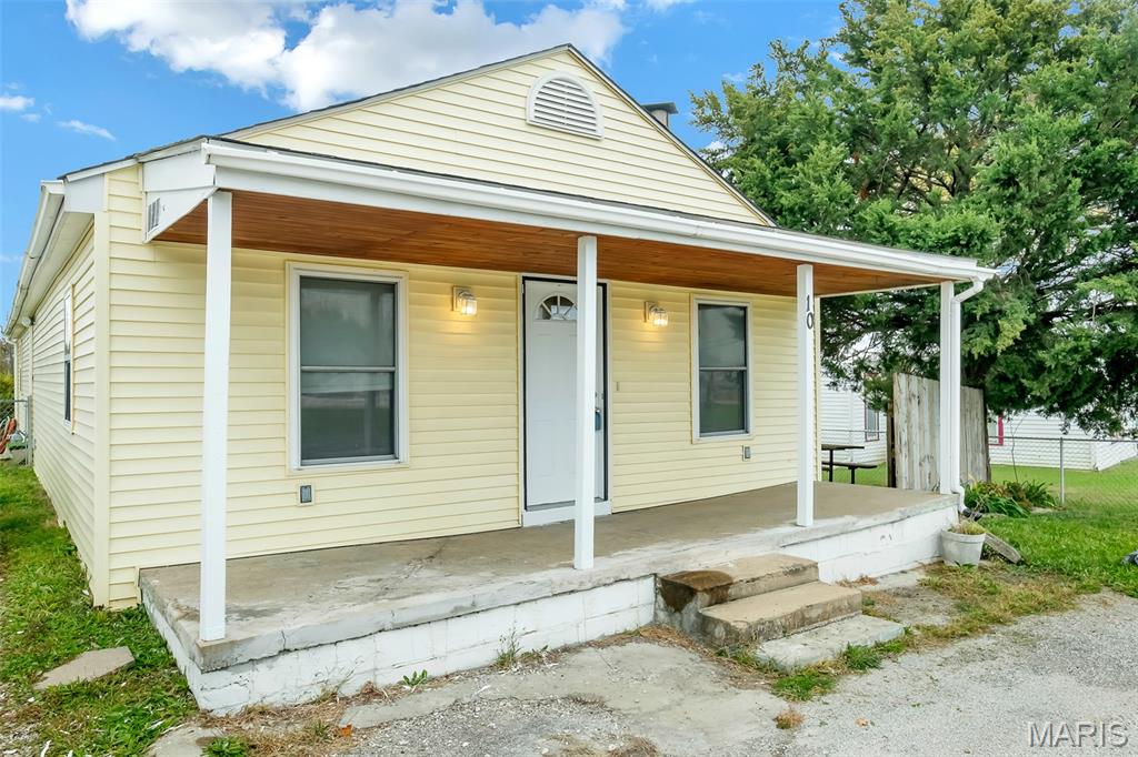 This is a charming home  and is well suited for a starter home or someone not wanting to be in a rental anymore.  Why rent when you can own.  The home has so much to offer with a large yard that is fully fenced, Vinyl siding, inclosed soffit and fascia and patio for outdoor enjoyment. You will find a free standing out building for your lawn equipement.  The inside has beautiful hardwood floors, caramic tile in the 3 bedrooms for allergy free flooring. The master bedroom has a large walk in closet, and master bathroom with a soaker tub/shower.   Nice size mudd room and laundry.  The home has a charming woodburning fireplace for the cosy winter nights.   There is 2 full bathrooms and 3 bedrooms. The kitchen is equiped with dishwasher, stove and  pantry.    The home offers a partial basement that is used for storage.  Come and take a look at this great find. Additional Rooms: Mud Room
