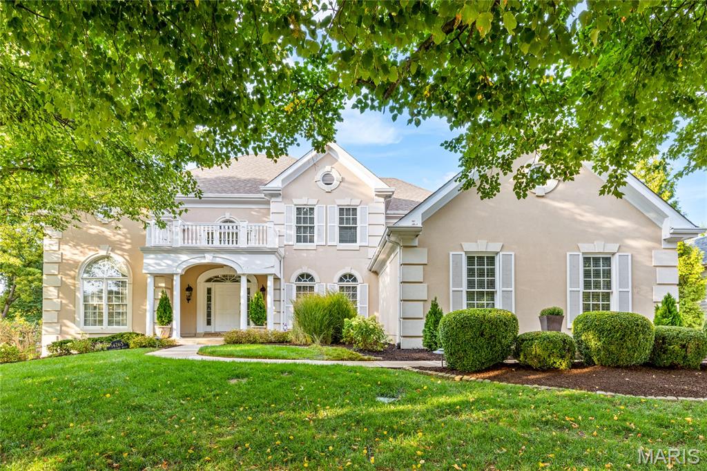 This beautifully designed Miceli-built 1.5 Sty features well-proportioned rooms with soaring ceilings, oak & marble flooring, detailed trim work & palladian windows. Impressive 2-sty marble foyer highlighted by flared staircase leads to well-appointed study, dining room with wide arched entryway and stunning great room with marble fireplace, wet bar & dramatic wall of windows. Spacious open kitchen with 42” white cabinetry, premium appliances, center island & butler’s pantry adjoins vaulted breakfast room with convenient planning center & hearth room with floor-to-ceiling stone fireplace. Primary bedroom suite with 2 walk-in closets & luxury bath with jetted tub offers an appealing retreat. Front & rear staircases access 3 additional bedrooms, 1 with ensuite bath & 2 with Jack n’ Jill bath. Walk-out Lower Level includes recreation room with entertainment center & wet bar, game room, 5th bedroom & full bath.  Professionally landscaped lot with patio, deck, screened porch & 3-car garage.