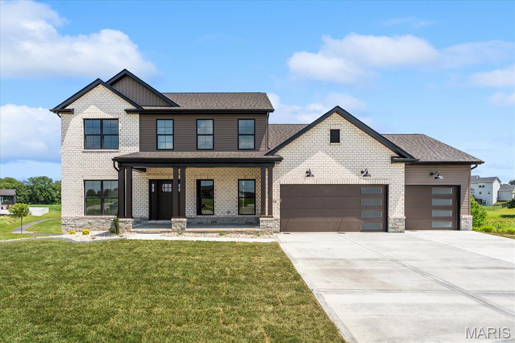This two-story, 5-bedroom, 3.5-bathroom home offers 3,940 square feet of thoughtfully designed living space and an open floor plan with nearly 4,000 square feet to enjoy. As one of our largest models, this home is being constructed on one of the premier cul-de-sac lots within the Savannah Hills community. The property backs directly to the Savannah Hills park and walking trail, providing exceptional privacy with no rear neighbors. A main-floor primary suite is the standout feature of this floor plan, offering convenience and comfort. The second level includes three additional bedrooms along with a spacious rec area, creating the perfect setup for family or guests. The finished walkout basement is ideal for entertaining, complete with an additional bathroom and a large bar featuring an island, plus a dedicated workout room with durable gym rubber mat flooring. Designer finishes have been carefully selected throughout the home, including Bastion Elm luxury vinyl plank flooring, Directions Classic tile, and Elk Beige carpet. The kitchen showcases a striking two-tone cabinet design with Arctic upper cabinets and Pecan Pie lower cabinets that continue throughout the rest of the home. Quartz countertops in the kitchen and basement bar are still customizable, allowing buyers to make their personal selection, while Glacier White Onyx tops are featured in the bathrooms and laundry room. Located in the growing Savannah Hills subdivision, residents enjoy access to scenic trails, a community park, and pool—making this home the perfect blend of luxury, function, and lifestyle.