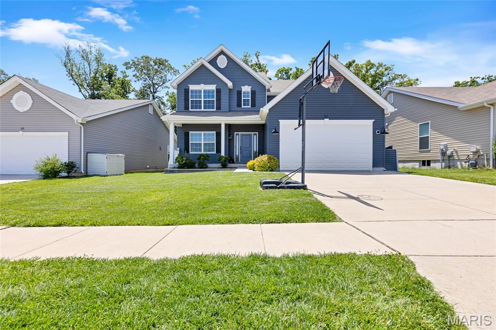Beat the rush before the next school year starts, this Wentzville beauty is just 5 years young and ready for you to call it HOME! Located in the highly sought after Oaks at Lexington community on a quiet street, this one is sure to win you over. This stunning two story with beautiful curb appeal features 4 bedrooms, 2.5 baths, soaring 9 ft ceilings, and tons of space for any size family. The main floor entry foyer flows seemlessly into the formal living room and dining room. Take note of all the natural light flowing through the great room windows! The kitchen will wow you with beautiful stainless appliances, solid surface countertops and beautiful backsplace. Main floor also features a convenient powder room, spacious laundry room, and walk in pantry! The second floor features a HUGE primary suite with large walk in closet and private ensuite bath with separate marble shower and jacuzzi tub. The three additional bedrooms each features its own walk in closet! This entire home is comfortable year round with dual zoned HVAC. Lower level is just waiting for your finishing plans. Step out the back door and onto the oversized concrete patio with a yard that's just perfect for entertaining or relaxing each evening. This much home at this price is too inviting to ignore. Schedule a time with your favorite Realtor to tour this one before the sign reads SOLD!