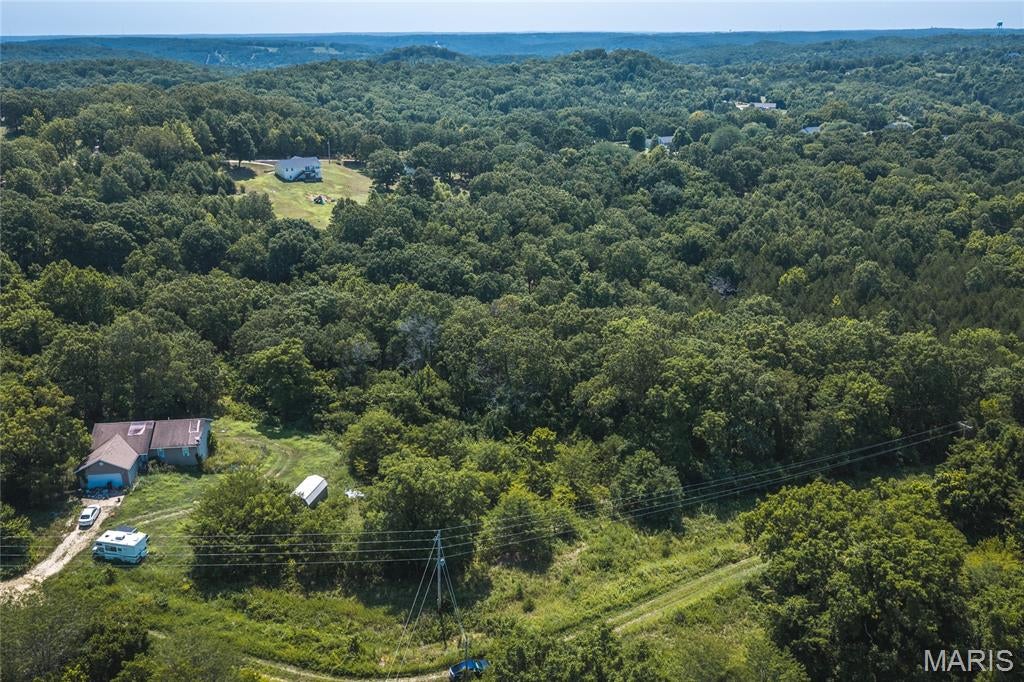 Discover the perfect setting to bring your dream home to life on this beautiful 2.81-acre residential lot in the desirable Equestrian Estates Subdivision. Tucked away at the end of a quiet dead-end road, this property offers the rare combination of privacy, peaceful surroundings, and the space to create the lifestyle you've always envisioned. Whether you're dreaming of a custom-built home with room to roam, a spacious outdoor entertaining area, or simply a place to enjoy the beauty and tranquility of nature, this lot provides the ideal foundation. The secluded location offers a sense of escape while still allowing convenient access to nearby amenities, giving you the best of both worlds. With electricity & water available nearby, you'll have a head start on building your future home while enjoying the flexibility to design a property that perfectly fits your needs. Imagine mornings spent watching the sunrise over your own acreage, evenings gathered around a backyard fire pit, and plenty of room for gardens, recreational space, or simply enjoying the privacy that larger lots provide. Opportunities to own premium acreage in Equestrian Estates are becoming increasingly rare. If you've been searching for the perfect homesite that combines space, seclusion, and endless possibilities, this is the property you've been waiting for. Start planning the home you've always wanted and schedule a visit today to experience everything this exceptional 2.81-acre lot has to offer!
