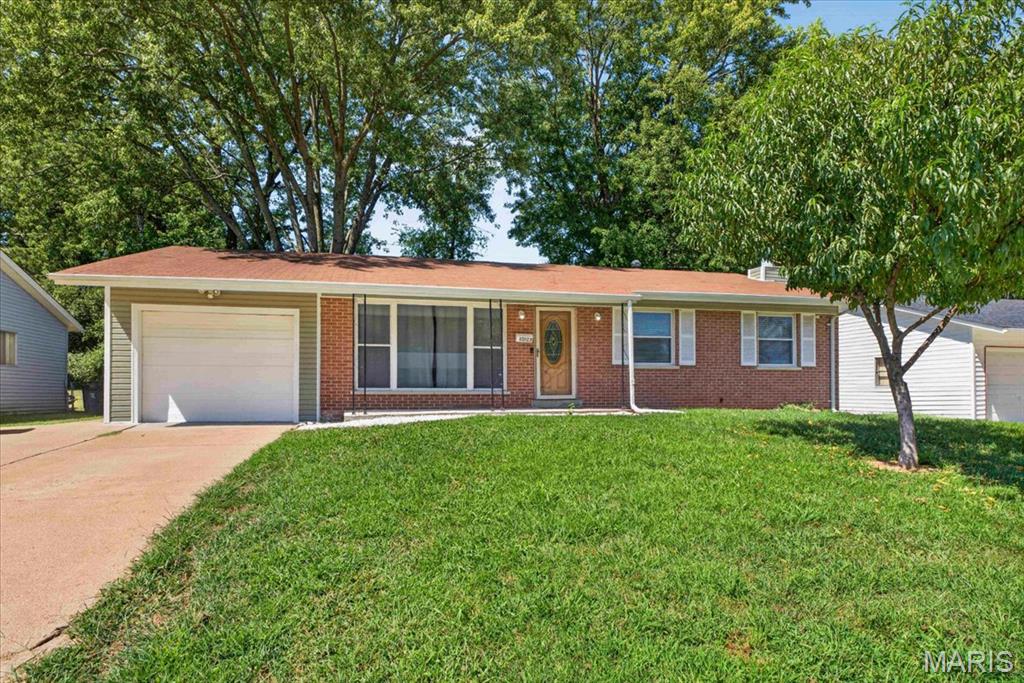Welcome Home to 10103 Chambers Hill Dr! Want to be in a new home for the holidays? This Updated Ranch Home offers over 2,000sqft of Living Space, a Finished Lower Level, and the peace of mind that comes with already passing St. Louis County’s Occupancy Inspection. From the moment you step inside, this home feels chic, comfortable, and ready to make it your own. Large picture windows fill the Living Room with natural light, while recessed lighting keeps the space bright and inviting day or night. Updated Vinyl flooring leads into the Dining Room, which seamlessly connects to the Kitchen through the Breakfast Bar. The Updated Kitchen boasts a trendy backsplash and newer range hood and is conveniently positioned next to the 1 car garage making unloading groceries simple. The sliding glass doors open to the backyard, making summer BBQ’s and everyday outdoor living a breeze. The Primary Bedroom features dual closets and Private Full Bath with walk in shower. Two additional bedrooms and full hall bath complete the first floor. Need more space? Head downstairs to the sizeable Family Room, which offers endless possibilities to match your lifestyle. The decorative Fireplace with stone accent wall creates a cozy focal point. The bonus sleeping room and half bath offer even more flexibility, perfect for guests, hobby room, or home office. The major systems have already been updated for your convenience; boasting New Siding (8/2026), Updated HVAC (2020), Water Heater (2020), and Roof (2020). Fresh, neutral paint throughout provides a clean backdrop for your personal style. Move in ready, thoughtfully updated, and ready for its next chapter, all that’s left to do is decide where the furniture goes.