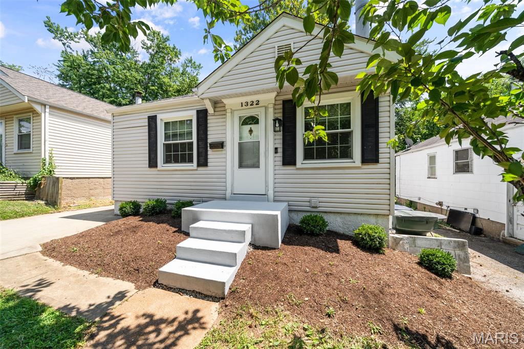 Welcome home to 1322 Fairmount Court ... you won't want to miss this Dogtown darling with an updated kitchen and an open, airy floor plan. This 2 bed, 1 1/2 bath ranch lives much larger than it appears due to recent renovations that opened up the living room and kitchen to make everyday living and entertaining so much easier. The living room has a wall of built-ins and is open to the light bright kitchen that boasts a large center island with seating, quartz counter tops, and stainless appliances. The two bedrooms and hall bath complete the main floor. The partially finished lower level has a rec room with decorative fireplace, laundry room, half-bath, and plenty of storage space. There's also a unique detachable staircase that makes moving items downstairs easier. The mostly fenced back yard has a pretty patio for outdoor entertaining too!