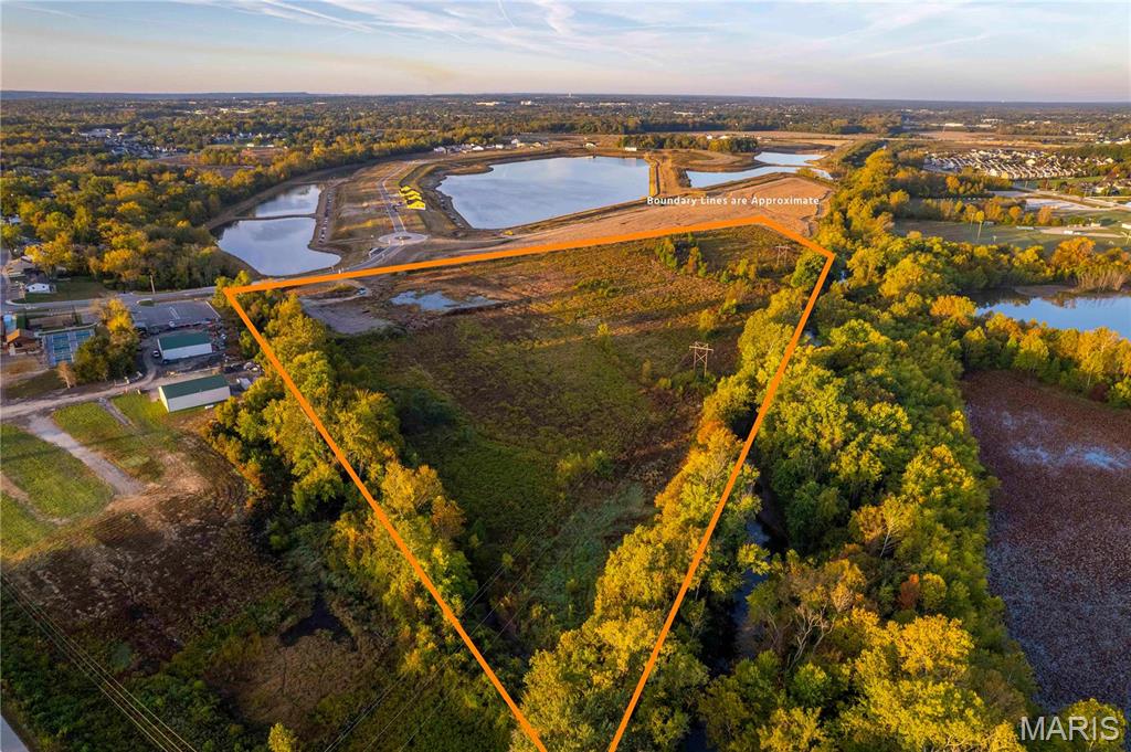 Great development opportunity in the city of Cottleville, MO. 23 +/- acres adjoining the brand new subdivision of Cottleville Trails! Located conveniently with access to Hwy 364, 64, and 70 within minutes. This site is just a short walk away from the growing downtown city of Cottleville, which gives a small town feel with all the big city amenities and activities. This acreage is in the Francis Howell School District and is currently zoned for residential use. Please reach out for aerial maps, land engineering plans, or any questions!