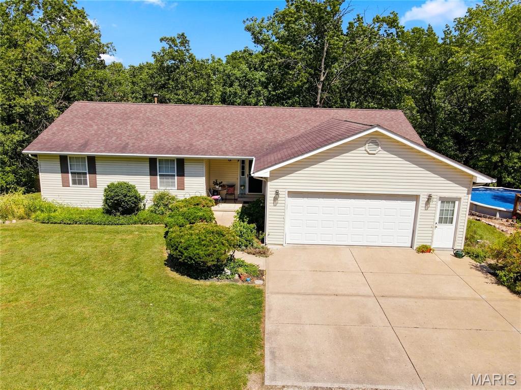 Escape to your own private 10-acre retreat, surrounded by mature trees and offering plenty of space to relax and enjoy the outdoors! This 3-bedroom, 2-bath home features an inviting floor plan with vaulted ceilings and an eat-in kitchen with a center island, perfect for everyday living and gathering. The walk-out basement is ready to be finished, offering endless possibilities for additional living space, a family room, home office, or recreation area. Outside, enjoy summer days by the above-ground pool, a fenced backyard, and your very own fully stocked pond. With 10 acres to explore and trees surrounding the property, you'll love the privacy and peaceful setting this home provides. If you're looking for acreage, privacy, outdoor recreation, and room to make a home your own, this property has so much to offer!