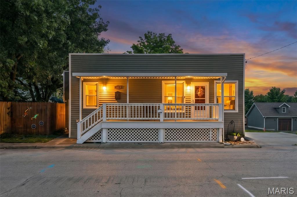 Welcome to 415 McDonough Street, a charming piece of Historic St. Charles! This 2-bedroom, 1-bath home offers the character and appeal you would expect from a 1920s property, paired with a location that puts you close to the best of Main Street. Enjoy nearby restaurants, boutiques, local events, the Missouri Riverfront, and the brick-paved charm that makes this area so desirable. The home features a comfortable 1-story layout with inviting living space and endless potential to make it your own. Bedrooms are spacious with one having a walk-in closet and the other leading out to a little private outdoor area. The living room has a sleek fireplace and the kitchen has plenty of cabinetry and a fantastic center island. A full basement offers additional storage and access just off the covered front porch. Whether you are searching for a cozy primary residence, a low-maintenance getaway, or a property with investment possibilities, this unique Historic St. Charles gem is one you will want to see. Refrigerator, washer, dryer and Ring alarm system included (2-outside cameras and camera doorbell also window and door sensors and motion detectors inside).