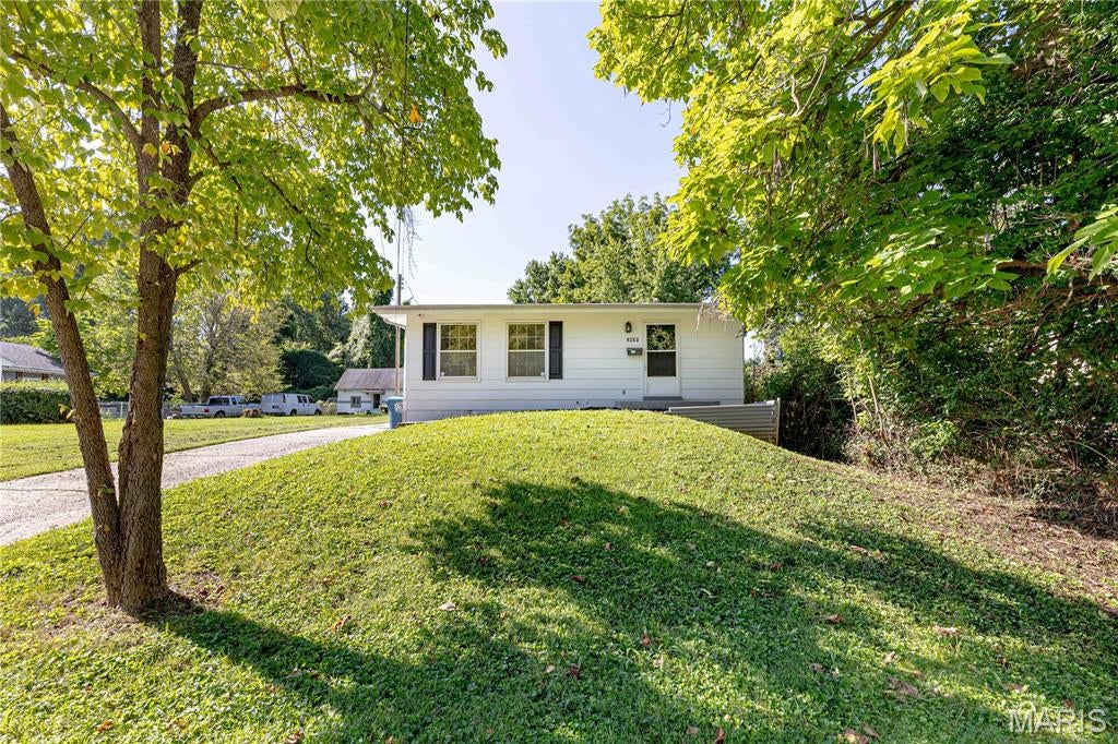 Showings start Saturday 8/22/26. **SELLER WILL PROVIDE PASSED OCCUPANCY**WOW!  You are not going to miss this one! Spacious 3 bedroom 2 bath home with an oversized 2 car garage.  With 1350 sq feet of living space, this could be your  super cute new home or your next rental property!  Light and bright and airy with lots of windows.  Step inside to entry foyer and walk into large front living room.  Walk down the hall to the primary bedroom with updated en suite bathroom. Primary bathroom has been updated with new shower doors, vanity, lights, faucet, mirror.  Additional two bedrooms share a hall bathroom.  Hall bath has been updated with new flooring, vanity, lights, mirror, faucet. Large family room towards the back of home with decorative fireplace and mantel.  Efficient kitchen with wood cabinets, new stainless steel stove, tile backsplash and new wood countertop. Breakfast bar.  Generous closets in this home.  TWO car side garage, perfect for your vehicles and extra storage.  Extra long driveway for extra parking. Clean, freshly painted full unfinished basement with w/d hookups. Nice level fenced backyard, perfect for entertaining.  New Thru-out: fresh neutral paint, beautiful newly refinished hardwood floors, LVP flooring in bathrooms and kitchen, light fixtures.  LOCATION! LOCATION! LOCATION!  Close to parks, highways, shopping, restaurants and MORE!!  This home is ready for you! Owner/Broker