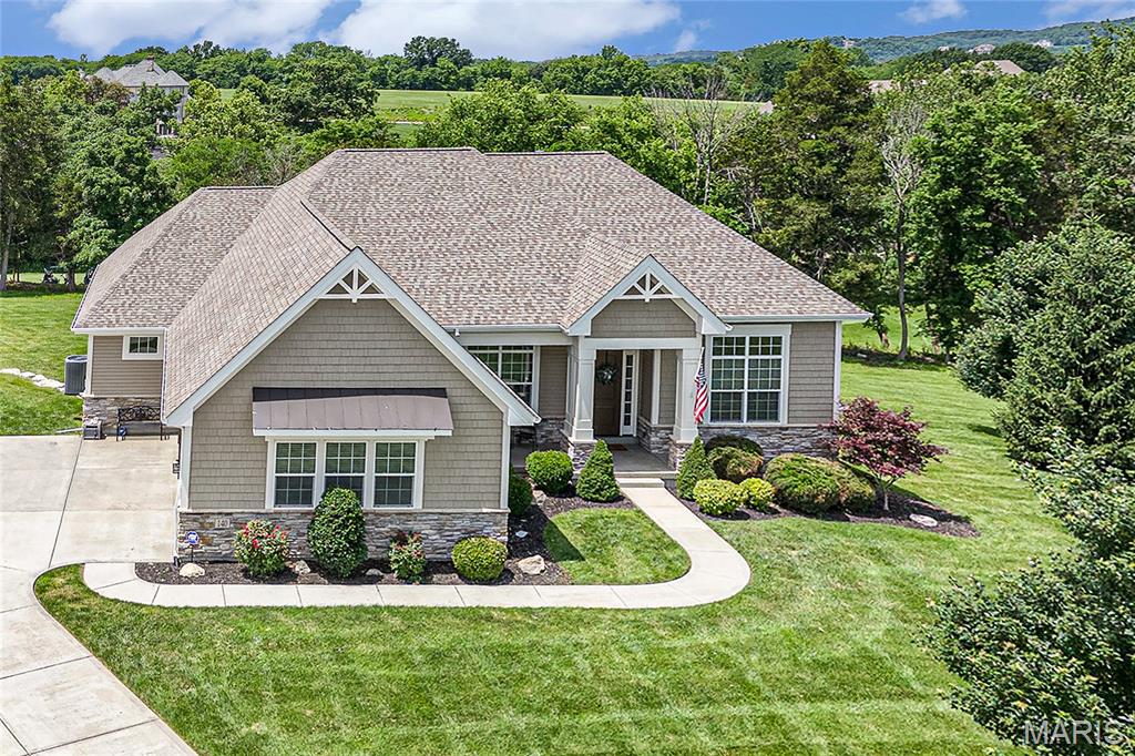 Stunning atrium ranch on premium 1.36-acre cul-de-sac lot on Pevely Farms golf course! With over 4,300 sqft of beautifully finished space, this light-filled home offers private views from every angle. The spacious and open floor plan welcomes with 12’ ceilings, 8’ doors, oversized windows with added transoms, gorgeous wood floors, formal dining and front office with glass doors. Chef’s kitchen features custom cabinetry, huge island, gas cooktop, double wall ovens, stainless steel appliances, stone backsplash, granite counters & designer vent hood, all open to spacious living room w/ stacked stone fireplace with wood beam mantel. Wall of windows along the open stairs to LL bring tons of light and impressive sunroom off kitchen leads to composite deck and amazing yard. Primary suite offers private entry with tray ceiling, spa-like bath w/ dual vanities, tiled dual-head shower plus large linen & walk-in closets. Mudroom w/ cubbies at garage entry, half bath, separate laundry room plus 2 secondary bedrooms with walk-in closets and full bath complete the main level. Outstanding lower level w 4th bedroom, full bath, large windows and full bar with multiple rec areas. Walk out to covered patio w/ under decking and fire pit extension to enjoy peaceful views of the expansive yard between the 12th & 13th holes. Rockwood Schools, close to I-44, future Route 66 State Park Bridge and neighborhood path leading to Castlewood Park trail system. Truly a must see!