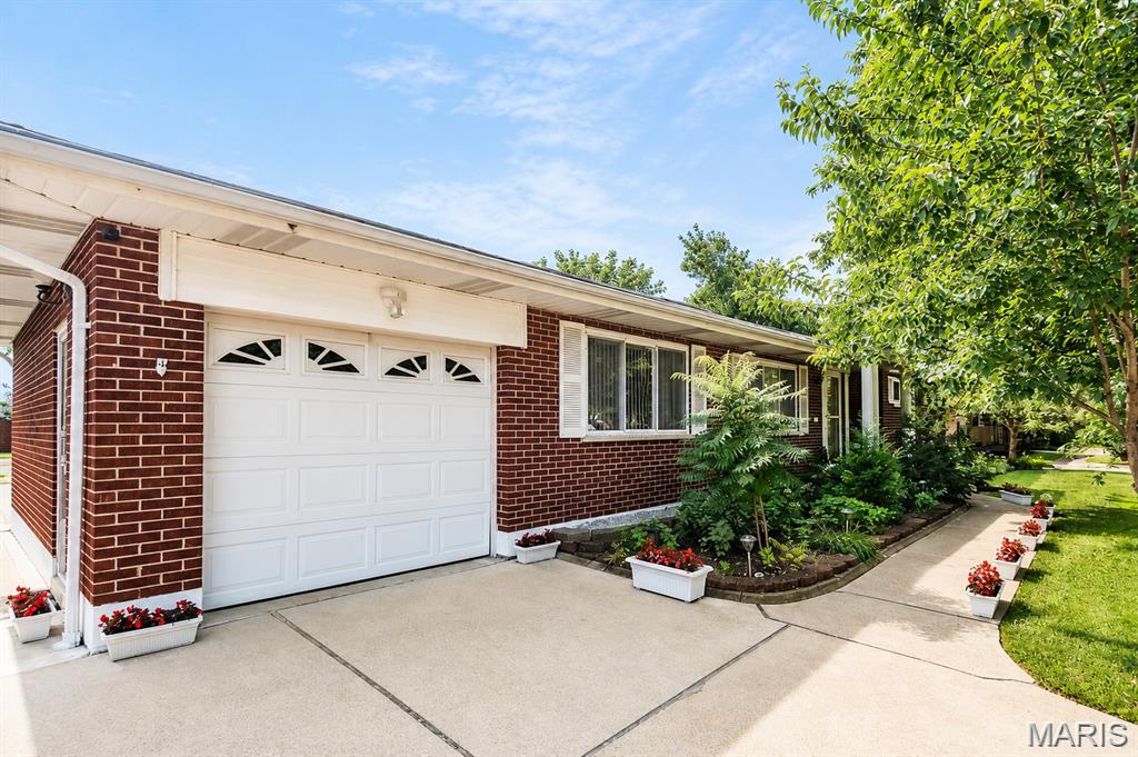 Welcome to a thoughtfully updated brick ranch in an established Affton neighborhood. Inside, you’ll find a kitchen with modern finishes, updated bathrooms, and hardwood floors that run throughout the main level, along with a new roof in 2026. The main floor offers three comfortable bedrooms, two dining areas, and a bright sun porch that brings in great natural light. The primary bedroom also includes its own half bath, adding everyday convenience. Downstairs, the finished walk-out lower level opens directly to the backyard and adds even more flexible living space, including a full bathroom and two additional rooms. The layout works well for a guest suite, a home office, hobby area, or extra living space. With walk-out access, natural light, and a direct connection to the outdoors, the lower level feels like a true extension of the home rather than a typical basement. Out back, an established garden and comfortable outdoor space give you room to relax, enjoy weekend projects, or gather with friends on summer evenings. A large neighborhood park sits just up the street, with wooded trails, a playground, and a connection to the Grant’s Trail greenway. Shopping and dining along Gravois Road are close by, and downtown St. Louis is an easy drive away. Move-in ready, well located, and full of flexible space inside and out. Come see it for yourself.”