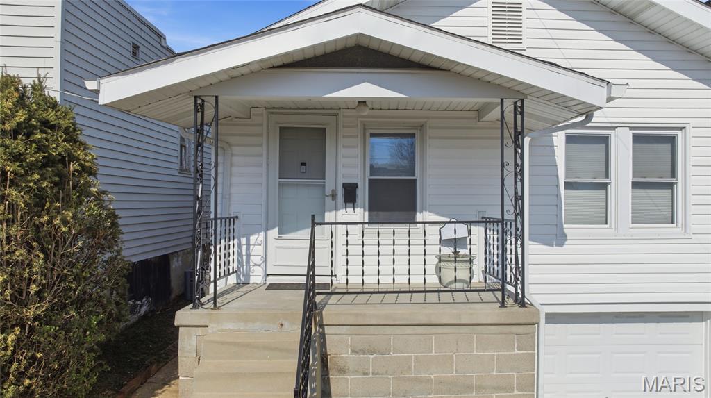 Updated home in Boulevard Heights with fresh paint and wood flooring. Major updates include newer siding, HVAC, and updated electric. Convenient location with easy access to parks, shopping, and major roadways. Level, fenced backyard backs directly to Joseph Leisure Park! Close to Christy Park and Carondelet Park for easy access to green space and walking trails. Composite deck offers low-maintenance outdoor living and is great for entertaining. Office space right off the living area. Walkout basement with garage door access provides additional storage or workspace. Off-street parking included. Showings start Saturday 3/28.