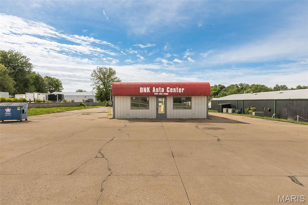Excellent location, great highway visibility, and quick and easy access to Hwy 364. Commercial, Retail, or Light Industrial - Free Standing Building - over 2,500 SF on nearly an acre. Building has 4 drive-in doors and approximately 40 parking spaces. The billboard located on property is currently leased.