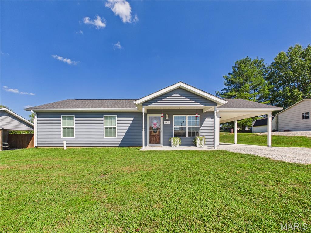 Cute, convenient, and ready to welcome you home! Built in 2021, this 1040 square ft slab home offers 3 bedrooms, 2 full baths, and a location that makes getting to I-55, Cape Girardeau, Jackson, or Perryville simple. Inside, the open concept layout brings the living room, dining area, and kitchen together in one bright, welcoming space. The kitchen is nicely equipped with stainless steel appliances, including a dishwasher, microwave, stove, and refrigerator. The primary suite features a full bath with a 5' shower and walk-in closet, giving you a little extra space to spread out. Luxury vinyl tile runs throughout, adding to the easy maintenance of all main level and all electric. Step outside to a large, fully fenced backyard with plenty of room to play, relax, or let the pups run. A covered front porch, carport, and easy to love layout round out this sweet little home. Come take a peek - you might just find the one!