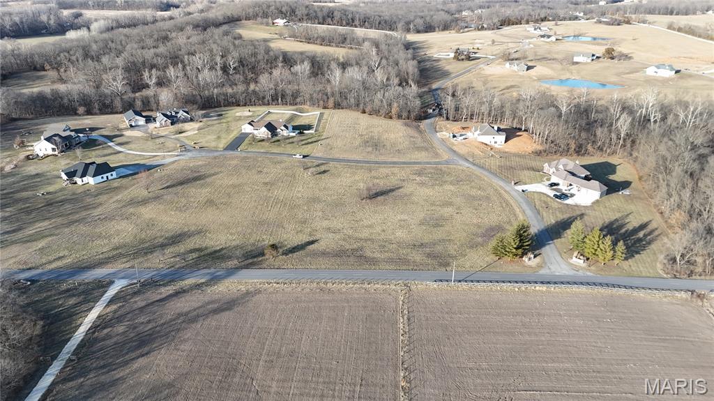 Country living just minutes away from town. This lot is perfect for a custom home build with your own plans and builder. Water and electricity are already on site! Restrictions for owner’s protection. This lot is open and level located at the very beginning of the subdivision for easy access with corner appeal. No shouses or barndominiums.