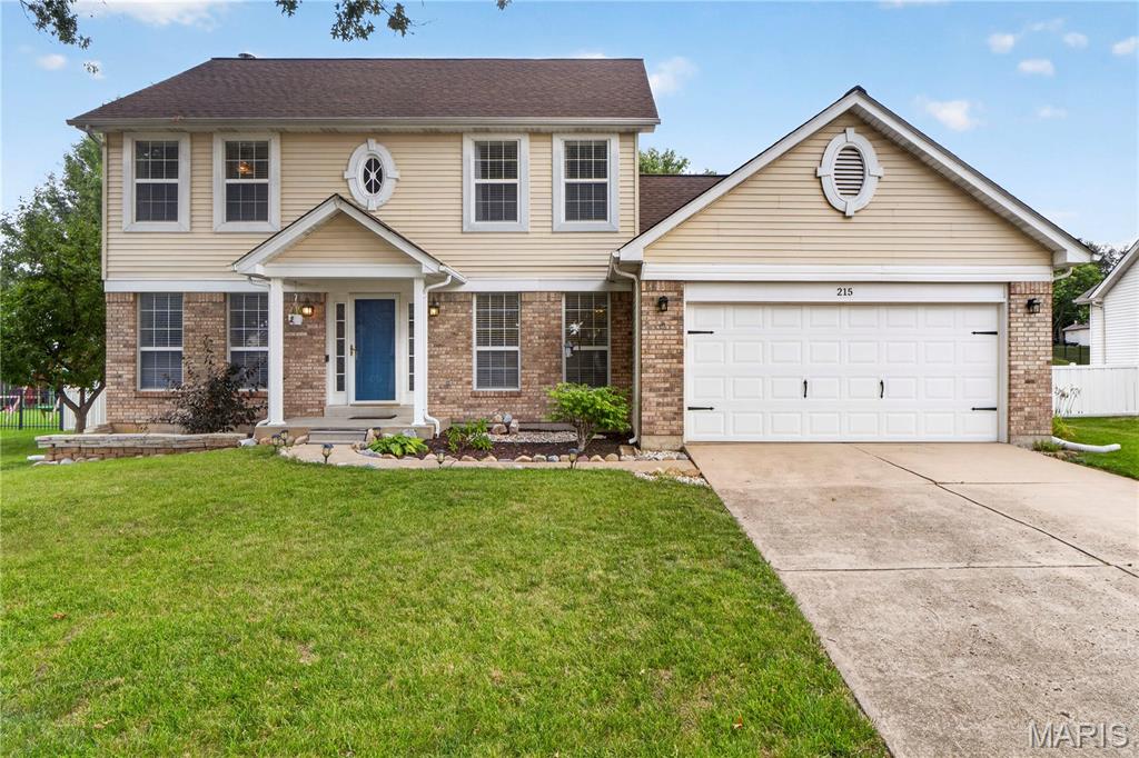 Welcome to 215 Waterford Crossing Drive - a lovely, well-maintained home with great curb appeal, located in a very warm and friendly neighborhood! Open floor plan with beautiful wood floors throughout the main level with tile flooring in the laundry room and guest bath. Main level has a welcoming entry, a formal living room (or a home office!) and a spacious light-filled family room with fireplace and large 5 window bay with view of stunning back yard! The gourmet kitchen has stainless appliances, granite countertops, a center island, pantry and breakfast/dining area with bayed door leading to the large covered patio and beautiful fenced yard.  The formal dining room is perfect for family gatherings or for entertaining friends and guests!  The upper level has 4 bedrooms and two full baths.  The spacious primary suite has two closets and a large bathroom with tile floor, oversized vanity, a soaking tub and separate shower.  Three additional bedrooms and another full bath complete the upper level!   Full basement can be finished if additional living/recreation space is needed!  Awesome outdoor space and a two car garage.  Convenient location and very welcoming neighborhood - close to top-rated schools, golf course, parks, shopping centers, walking trails, and recreational facilities!

Living Room/Study and Family Room are "Virtually Staged"

Street leading from Highway K into the neighborhood is currently under construction and may be blocked off as the road is repaired/replaced - May be necessary to enter the subdivision using the street to the south (Sports Park Drive) which leads to the soccer fields and golf course and to Waterford Crossing Drive! Navigation System may be helpful!