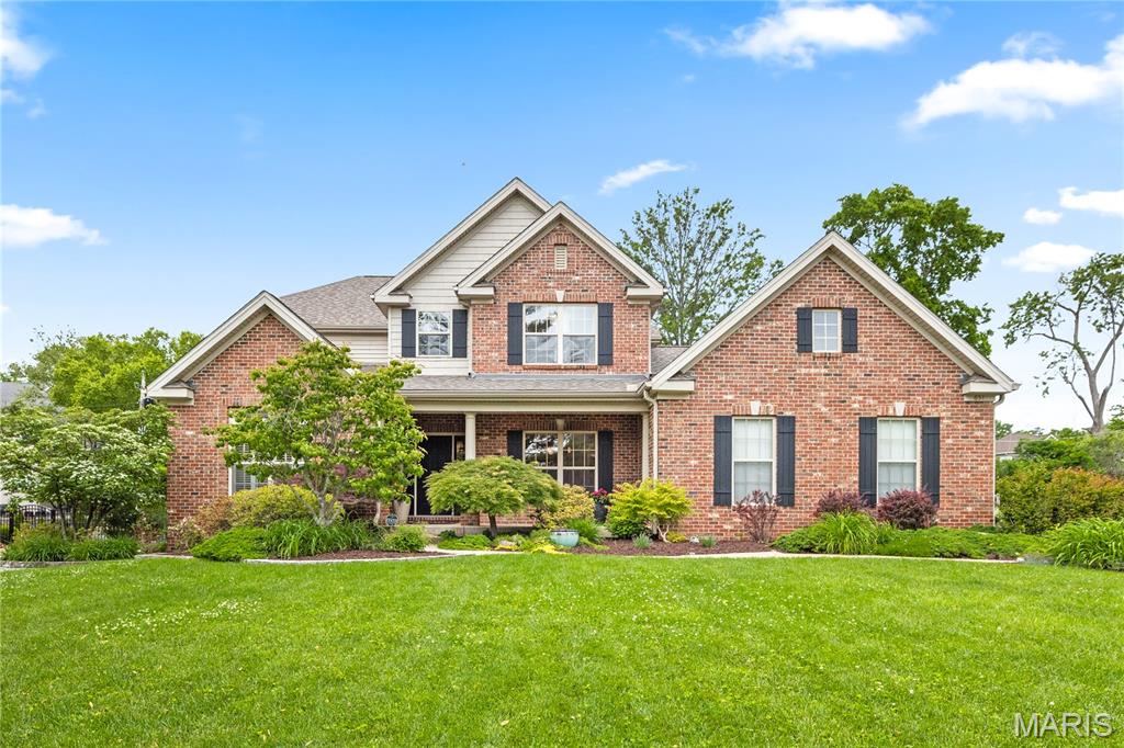 This newer home is designed for refined living without sacrificing comfort or style. From the moment you enter, the thoughtful flow and sense of space create an immediate feeling of luxury and ease. The welcoming foyer opens to a gracious dining room with chair rail molding, a tray ceiling, and large windows overlooking the manicured front yard. The layout flows effortlessly into a serene living room with built-in cabinetry and expansive windows framing the backyard. At the heart of the home, a beautifully appointed kitchen, informal dining area, and family room open to a spacious deck and established yard—an ideal setting for both everyday living and entertaining. The kitchen features granite countertops, a large island, double ovens, a Thermador five-burner gas cooktop, and a professionally organized pantry. A butler’s pantry adds convenience and elegance for hosting. The main-level primary suite offers a private retreat, complete with a sitting room with floor-to-ceiling built-ins, two walk-in closets, and a spacious en-suite bath. Rich wood floors, abundant natural light, and 9-foot ceilings enhance the main level, which also includes a laundry room and direct access to the attached two-car garage. Upstairs, a striking staircase with wrought iron balustrades leads to a sitting area—perfect for an upstairs den or study. Bedrooms two and three share an en-suite bathroom. Bedroom four has en-suite access to the 2nd full bathroom, and all the bedrooms feature a walk-in closet. The lower-level recreation room is bright and inviting, with high ceilings and a fourth full bathroom, offering versatile additional living space. The cedar closet and tremendous storage space make life easy. With a one-year-old high-efficiency zoned AC, easy access to a bike path, and within walking distance of Stacy Park, this home offers an exceptional backdrop for comfortable and beautiful living.