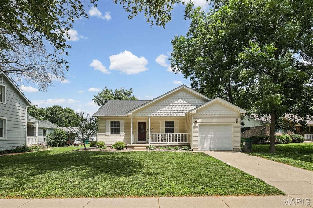Move right into this beautifully updated ranch home offering an open floor plan, finished lower level, and a fantastic backyard designed for relaxing and entertaining! The covered front porch provides the perfect spot to unwind or greet family and friends. An attached one-car garage features an insulated garage door for added comfort and efficiency. Step inside and be welcomed by a spacious foyer with gleaming wood floors that continue throughout the main living areas. The inviting living room flows seamlessly into the kitchen, creating an ideal gathering space. You'll love the breakfast bar, corner sink, stainless steel appliance package('21), large pantry and recent updates including new lighting, cabinet hardware & ceramic tile backsplash. The dining area showcases wood flooring and a sliding glass door leading to the backyard. The primary suite offers a ceiling fan and a beautifully updated private bath featuring plank-style ceramic tile flooring, a ceramic tile shower surround, a five-foot glass-enclosed shower with handheld sprayer, three body jets, and overhead showerhead, plus updated lighting, mirror, faucet, and hardware. Two additional generously sized bedrooms include ceiling fans, with one featuring wood flooring and the other carpet. The third bedroom also offers double closets and a convenient main-level laundry hookup. The oversized hall bath has been tastefully remodeled with plank ceramic tile flooring, linen closet, and updated mirror, lighting, faucet, and cabinet hardware. The finished lower level expands your living space with a large family room featuring engineered wood flooring, canned lighting, and a bar area perfect for entertaining. You'll also find two bonus rooms—ideal for a home office, exercise room or hobby space—along with abundant unfinished storage space. Outside, enjoy the extended patio complete with a built-in fireplace overlooking the large backyard. Additional updates include a new roof (June 2026), HVAC system (May 2026), water heater (2023), pressure washing (2026), radon mitigation system already installed, and sump pump. Conveniently located and truly move-in ready, this exceptional home is waiting for its next family to make it their own!