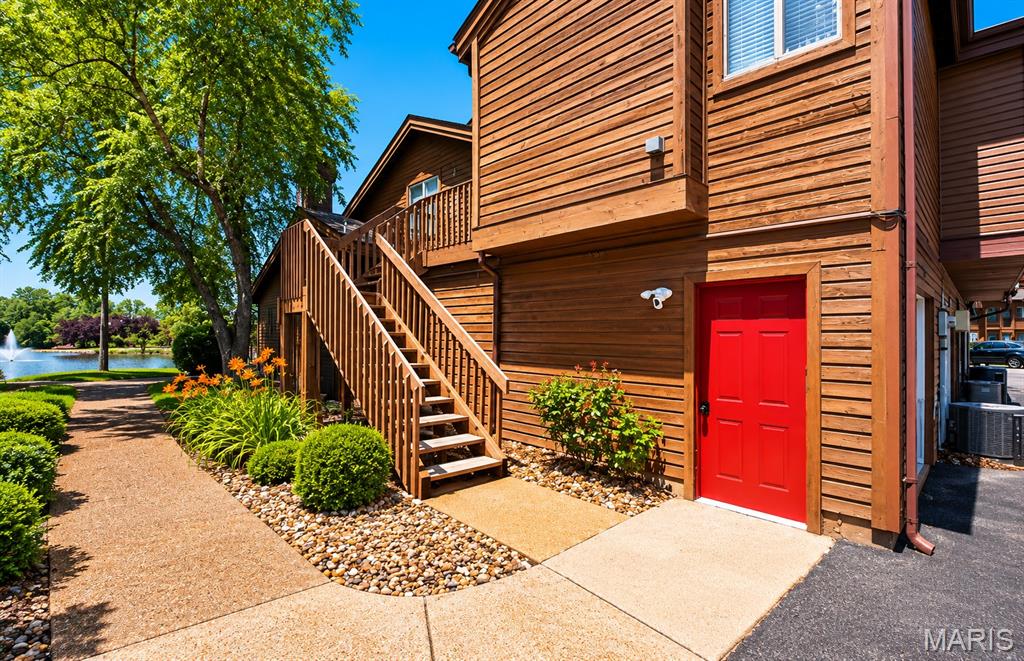 Welcome to this beautifully updated 2-bedroom condo in the highly sought-after Chapter One Condominiums subdivision. This charming upper-level end unit features an open floor plan with stunning bamboo hardwood flooring throughout the great room, dining area, and kitchen. Vaulted ceilings in the great room, dining room, and primary bedroom create a bright and spacious feel, while the cozy wood-burning fireplace adds warmth and charm.

The kitchen offers granite countertops, breakfast bar seating, and opens seamlessly to the living and dining areas - perfect for entertaining. The flexible 2-bedroom floor plan includes a spacious second bedroom currently used as an office space. The primary bedroom includes a walk-in closet and private balcony access. The bathroom suite features ceramic tile flooring, double sinks, and a Jacuzzi tub/shower combination.

Enjoy multiple outdoor living spaces including a private balcony off the primary bedroom with peaceful lake views and an additional deck with a lake view that is ideal for entertaining or relaxing. Additional highlights include an oversized tuck-under 1-car garage with shelving and abundant storage space. Community amenities include a gorgeous lake, clubhouse, in-ground pool, tennis courts, pickleball, and walking trails. Conveniently located near shopping, dining, and major highways.