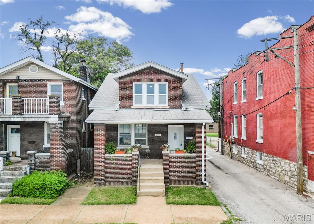 OPEN SAT 1-3PM! Attention house hackers - this is THE one. Outstanding Opportunity in Southwest Garden! Classic brick duplex with a two-car garage offering a great opportunity to live in one unit while generating rental income from the other. Covered front porch invites you to the inside of this multifamily. As you enter, entrance foyer separates both units from each other while providing shared basement access. Each unit features 2 bedrooms and 1 full bath, with updated kitchens and bathrooms, beautiful hardwood floors, central air, and plenty of natural light. Functional layout - spacious bedrooms and great living areas. 1F Unit is currently rented at $1,385 per month, while 2F is move-in ready for you! Already passed occupancy. The upstairs unit also features a spacious balcony. Enjoy a fenced backyard plus a detached 2-car garage - private parking, an excellent setup for an owner-occupant. Lower level basement with lots of storage room, washer & dryer hook up & a walk-up. Location, location! Conveniently located near The Hill, Tower Grove Park, Schnucks, Tilles Park, restaurants, and shopping, with easy access to Kingshighway and Hampton. Whether you're looking to offset your monthly housing expense with rental income or add a well-located two-family to your portfolio, 2921 Brannon offers flexibility in one of South City's most convenient locations. As an investor, the current vacant unit could also be an outstanding Airbnb / short term rental! CALL NOW