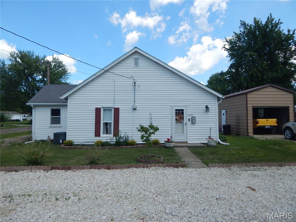 Charming 2 Bedroom 1 Bath home on the quiet side of town with an oversized well landscaped lot. This well-kept home would be a perfect starter home for the young or a nice cozy home for a retired couple.  Offers a 1 car 12x32 detached garage & a 12X14 utility shed.  Why pay Rent when you can own. Better call now, because we only have one home like this. Oh! the price is just $152,000