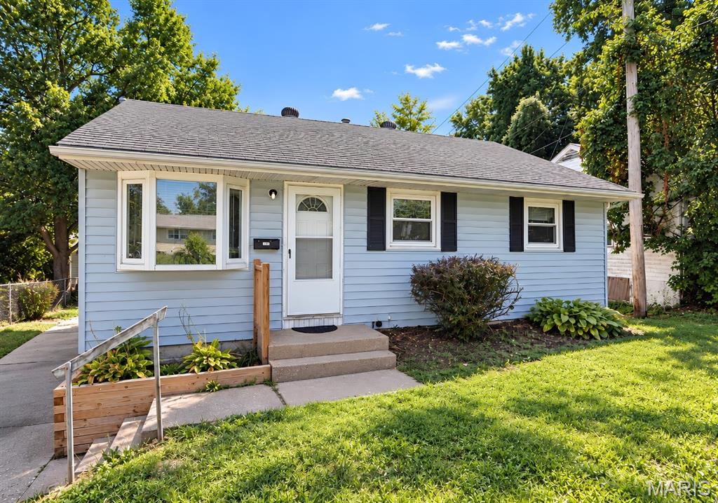 452 Shepley Drive. 3 bed, 1 bath ranch, updated and move-in ready. The big-ticket items are already handled: brand new HVAC, a newer roof, and a newer water heater.
Hardwood floors run through the living room and all three bedrooms. Fresh paint, white trim, and ceiling fans throughout. A bay window fills the living room with light. The kitchen has white cabinets, LVP flooring, and a breakfast bar that opens to the living room. Side entry off the kitchen. Full bath with tile tub surround and updated vanity. The full basement is the upside. Brick fireplace, built-in brick bar, and painted floors and walls. Finish it and add real living space. Outside: vinyl siding, a landscaped front, and a large, flat backyard with mature trees. Schedule your showing.