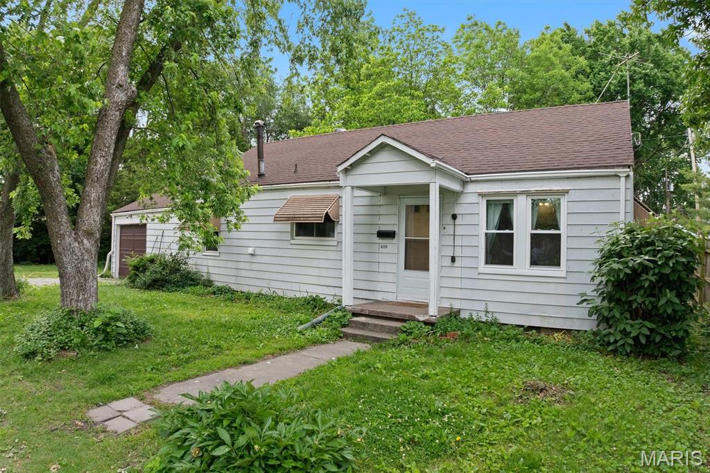 2 Lots on private no through road, Over-sized One Car Garage parking!!  Newer flooring, newer water lines, roof replaced in 2020 and ceiling fans in every room. New windows February 2026 - transferable warranty.  Move-in ready.  Convenient access to Route 3 and 255 makes this home the perfect location for Metro East commutes.  One level living with private back yard, 3 bedrooms and a full bath and extra storage area in garage and attic space.  Lots of shade and privacy with fenced back yard. Lot Acres and Taxes reflect totals for both parcels.