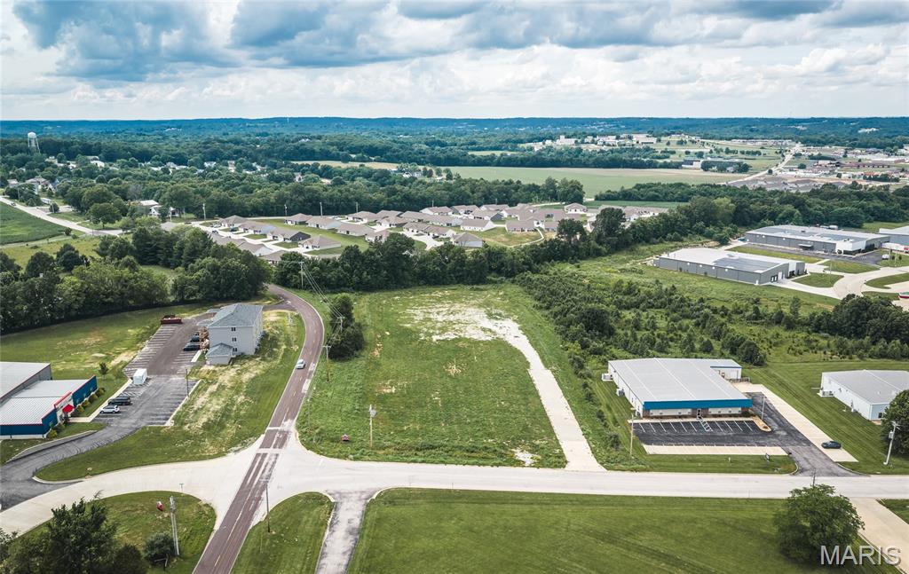 Prime 4.15-acre commercial lot located at the highly visible corner of Progress Parkway and Prairie Dell in the sought-after Union Corporate Center. Positioned within Union's thriving industrial district, this I-1 General Industrial zoned property offers an outstanding opportunity for businesses, investors, and developers looking to establish a presence in one of the area's fastest-growing commercial corridors.

Significant site improvements have already been completed, including extensive dirt work and grading, lot leveling, installation of a culvert, a poured concrete entrance, and approximately 500 tons of rock providing a solid road base and gravel parking/storage area. Utilities are available on site, helping streamline future development plans.

Surrounded by successful businesses and located directly across from the American Welding Academy, this property benefits from excellent visibility, accessibility, and proximity to a growing workforce. Nearby amenities include shopping, restaurants, and Veterans Memorial Park, making this an ideal location for a wide variety of industrial, commercial, or service-based uses.

Take advantage of this development-ready corner lot and become part of the continued growth and success of East Union.