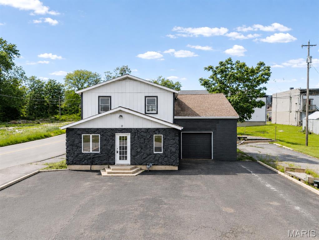THIS IS THE ONE! Outstanding commercial space with exceptional location off of Main Street in Festus. Right next to other businesses/ restaurants & coffee shops. Large, level lot with lots of parking spaces AND an attached garage (for additional parking or storage). Endless possibilities with this flexible layout and the additional expansion space upstairs - the second level is unfinished and ready for your vision! Turn it into more commercial space or convert into a residential unit for additional income $$$! Main level of commercial could be a great office space, doctor's office, retail/ store front or even conversion into a restaurant. What an investment - great location in Jefferson County with endless options! High visibility, close to I-55, US-67 & all other highways. As Main Street Festus continues to grow and attract new energy, this property positions you close to one of the most visible and recognizable commercial corridors in town. Whether you’re an owner-operator or an investor looking for your next strategic acquisition, the opportunity is right here! CALL NOW
