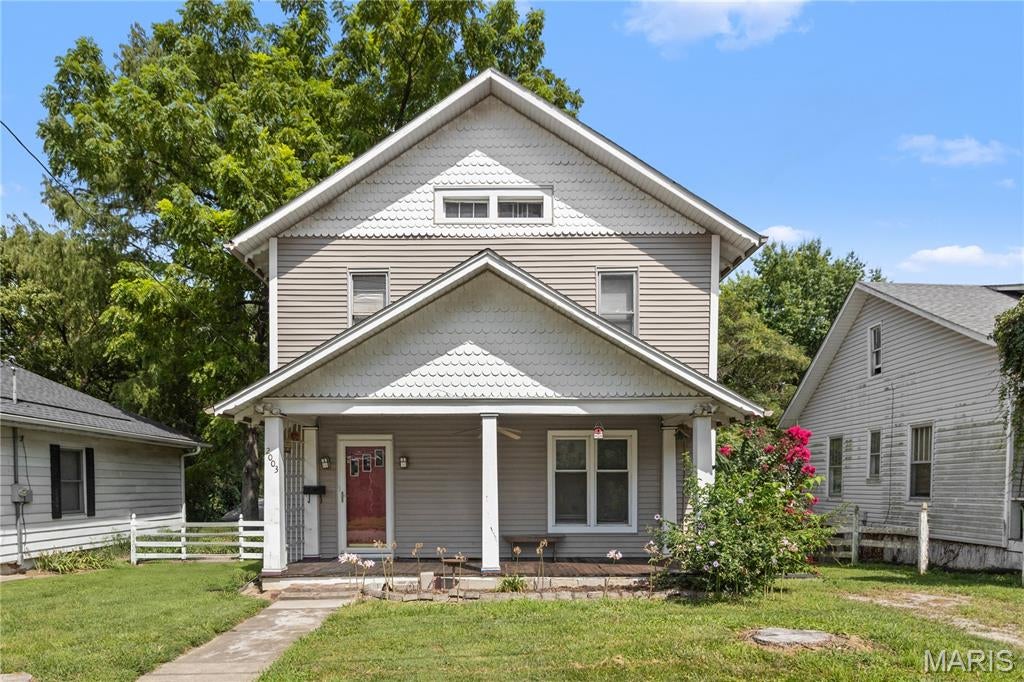 Welcome to this charming two-story home built in 1900, showcasing timeless character and modern convenience. Upon entering, you’ll be greeted by a stunning open staircase that adds elegance to the spacious layout. The large living room and dining room provide ample space for entertaining, while the eat-in kitchen boasts retro metal cabinets and an original countertop, perfectly blending vintage charm with functionality, including a classic cooktop stove. The second floor has a dedicated laundry room for added convenience, along with well-maintained hardwood floors that flow throughout the home, preserving its historic allure. The main floor includes a convenient toilet as well as one in the lower level.  This home is a perfect blend of classic design and practical living space, ready to welcome you!  2 refrigerators, the freezer in lower level, and the washer and dryer are included in the sale as well! This an estate and the seller is selling in "as is" condition.  Seller will provide an occupancy permit so buyer can move right in at closing.