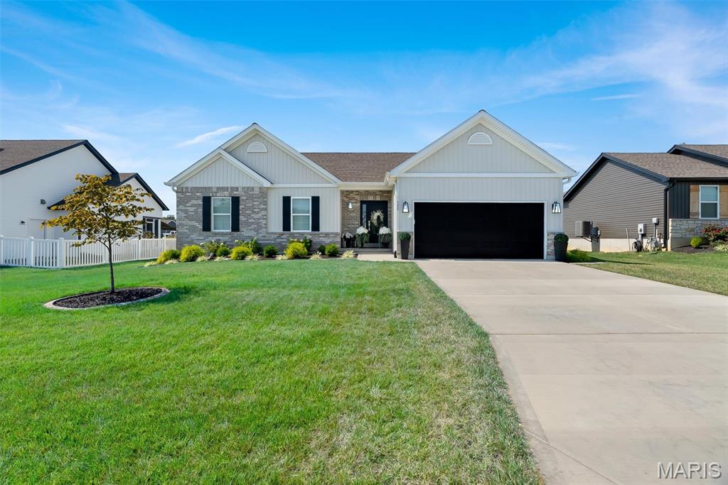Better Than New and Loaded with Over $100,000 in Upgrades!

Why wait months to build the Brianna Model with CMS when you can move right into this stunning, pristine 2-year-old home that shows like a model and offers luxury upgrades at every turn? Conveniently located near Highway 61 with easy access to schools, shopping, dining, and everyday amenities, this meticulously maintained home is truly a rare find.

Offering an incredibly versatile floor plan, this home features two bedrooms plus a dedicated office on the main level, providing the flexibility today's buyers desire for working from home, hobbies, or guest space. The finished lower level includes a third bedroom, creating additional living and sleeping accommodations ideal for guests, multi-generational living, or extended stays.

From the moment you arrive, you'll appreciate the professionally landscaped exterior, complete with an irrigation system, maturing trees, and a fenced patio designed for both beauty and privacy. Every detail has been thoughtfully selected and upgraded, creating a home that is anything but builder grade.

Step inside and fall in love with the impressive chef's kitchen featuring gleaming hard-surface countertops, a gorgeous designer backsplash, under-cabinet lighting, upgraded soft-close cabinetry, and convenient pull-out drawers designed to maximize storage and everyday functionality. The kitchen is further enhanced by a wall oven, built-in microwave, premium cooktop, and chef's hood, making it the perfect space for cooking and entertaining. Luxury vinyl plank flooring and soaring 9-foot ceilings throughout the main and lower levels create an open, spacious feel while providing elegance and easy maintenance.

The upgrades continue throughout the home, including custom plantation shutters, designer closet organization systems, and beautifully appointed bathrooms. The primary ensuite features a 2-foot room extension and the luxury bathroom upgrade, allowing for dual vanities, a large linen closet, and upscale finishes. All three showers showcase marble surrounds, sleek glass doors or splash guards, and high-end fixtures, eliminating the need for shower curtains. Even the smallest details have been elevated, reflecting the exceptional quality and care invested throughout the property.

The finished lower level provides substantial additional living space, including a private third bedroom, full bath access, and ample room for entertaining, recreation, or accommodating overnight guests. An upgraded atrium door with built-in blinds opens to an inviting backyard retreat. Enjoy your morning coffee or evening cocktails while overlooking the beautifully landscaped yard, designed to feel like your own private gated courtyard.

And the best part? This home is truly move-in ready. The kitchen refrigerator and washer and dryer set all convey with the property, allowing the new owners to move in and immediately begin enjoying everything this exceptional home has to offer.

Pristine, immaculate, and meticulously maintained, this home offers the luxury, craftsmanship, and upgrades today's buyers desire without the wait, uncertainty, or additional expense of building new. With over $100,000 in upgrades already completed, there is absolutely nothing left to do but unpack, settle in, and enjoy.

A home of this caliber is a rare opportunity. Schedule your private showing today and experience the difference for yourself.