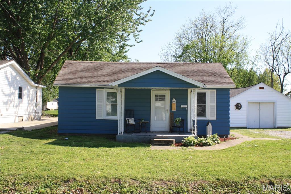 This home offers 2 bedrooms, 1 bath cabinet filled kitchen with lots of counter space front and back covered porches for relaxing detached garage and large lot and a half partially fenced yard - close to amenities
