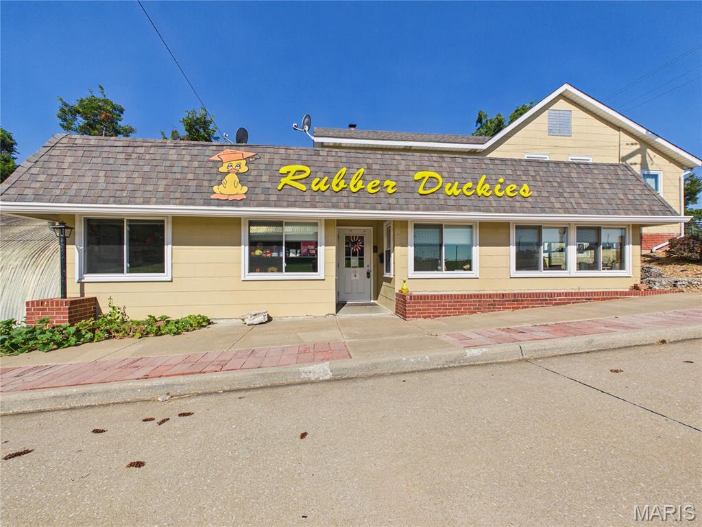 Turn-key business opportunity with incredible potential! This well-established commercial property offers over 4,000 square feet of versatile space, making it an exceptional opportunity for entrepreneurs, investors, or an established business looking to expand. Currently operating as a daycare, this property is ready for its next chapter and offers the unique opportunity to continue a proven use or bring an entirely new vision to the space. For those interested in starting or expanding a childcare business, potential grant assistance may be available. For additional information regarding available programs and eligibility, please contact Crystal Jones with the Perry County Economic Development Authority at crystal@perrycountymo.org. The spacious main level is thoughtfully designed for childcare operations, offering ample room for classrooms, learning stations, indoor activities, and play areas. The upper level provides exceptional flexibility and could be utilized for additional childcare space, office space, or even on-site living, subject to applicable licensing, zoning, and approval requirements. An added opportunity for a future daycare operator: The sellers are willing to include the existing daycare furnishings, equipment, and supplies with the sale at the current asking price, providing an estimated $30,000 in additional daycare-related value and allowing a new owner to step into an established childcare setup with many of the necessary items already in place. The current owners have made extensive improvements throughout the property, including new windows, updated HVAC systems, and a new roof over the flat portion of the building, all completed within the last five years, with several additional updates made within the past two years. Not interested in operating a daycare? Let your imagination take over! With over 4,000 square feet of space, the possibilities extend far beyond childcare, subject to zoning and any required approvals. Envision a boutique retail space, restaurant, brewery, winery, discovery play center, family entertainment venue, fitness or wellness studio, event space, professional offices, or something entirely unique. With its size, versatility, updates, established daycare layout, and potential for additional assistance for a new childcare venture, this property offers a rare opportunity to bring your vision to life. The possibilities are truly endless. Bring your dream, your passion, and your vision and make this exceptional property your next success story!