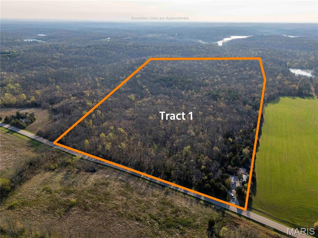 AUCTION LISTING - List price is not indicative of Seller’s final reserve amount.  This property is part of an online bidding event.  This sale will be executed with a no-contingency contract provided by the brokerage representing the Seller. See MLS Supplement Document for complete details.  

Bid your way to two distinct opportunities in the Perryville, MO area. Tract 1 offers 86.56± surveyed acres of recreational and hunting ground known as "Dogwood Hollow," while Tract 2 presents a 0.62± acre residential lot within the sought-after Lake Perry community. Located approximately 1 hour and 45 minutes from the STL Metro Area, these two tracts can be pursued together or separately.

Tract 1 (17827 Hwy T):  is set up and ready for the serious outdoorsman. Two camper sites with electric, an off-grid shower house, a shipping container, and two carports provide everything needed for a functional hunting camp. A cleared trail system allows easy navigation to food plots, the head of Nations Creek, and a notable bent oak toward the back of the property. Deer and turkey are well-established, and a healthy mix of oak, pine, and hickory offers potential timber income down the road.

Tract 2 (4012 Port Perry Dr): secures your place within the Lake Perry community — home to its approximately 200-acre namesake lake. The residential lot is ready to build on with water, sewer, and electricity already available. Community amenities include lake access, a pool, beaches, playgrounds, and a seasonal restaurant.

If you're looking for a hunting retreat, a weekend getaway, or both, be sure to check out these Perryville area offerings.