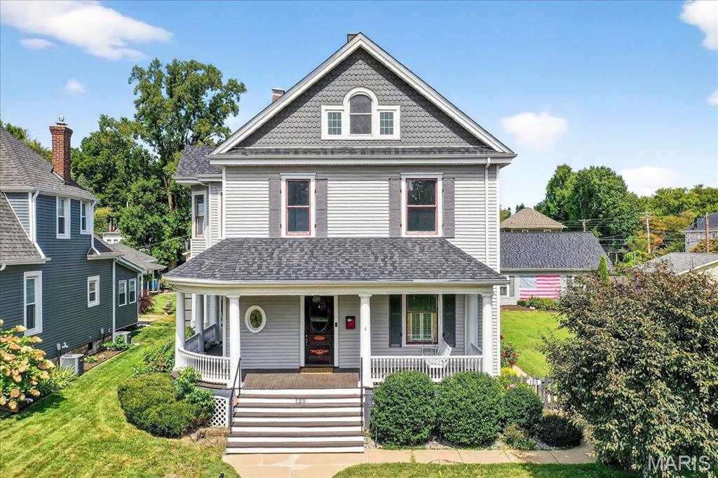 This historic 2-1/2 story 4+ bed, 3 bath Queen Anne style home is one of the crown jewels of St. Charles' Lindenwood Heights. Located one block from Lindenwood University and a 20-minute walk to French Town, Main Street and the Katy Trail, this turn-of-the-century home is situated on a double lot with a wrap-around front porch, private backyard patio, she-shed/playhouse and oversized 3-car garage. Other highlights include 4,200 square feet of living space on 3 levels, 10ft ceilings, exposed brick, original fireplace with remote lighter, hardwood floors and an expansive contemporary kitchen with a chef's island/breakfast bar, 8-burner range and walk-in pantry, plus a nearby laundry and bathroom. Front and back staircases lead to the 2nd floor with 2+ adjoining bedrooms and a beautiful primary bedroom with walk-in closet, en-suite bath, shower/clawfoot tub and double vanity. The entire 3rd floor is a finished loft space that's flexible for use as an add'l bedroom, game center, study area or home office. Also, all new high efficiency windows were installed in 2025. Great location and rental property!