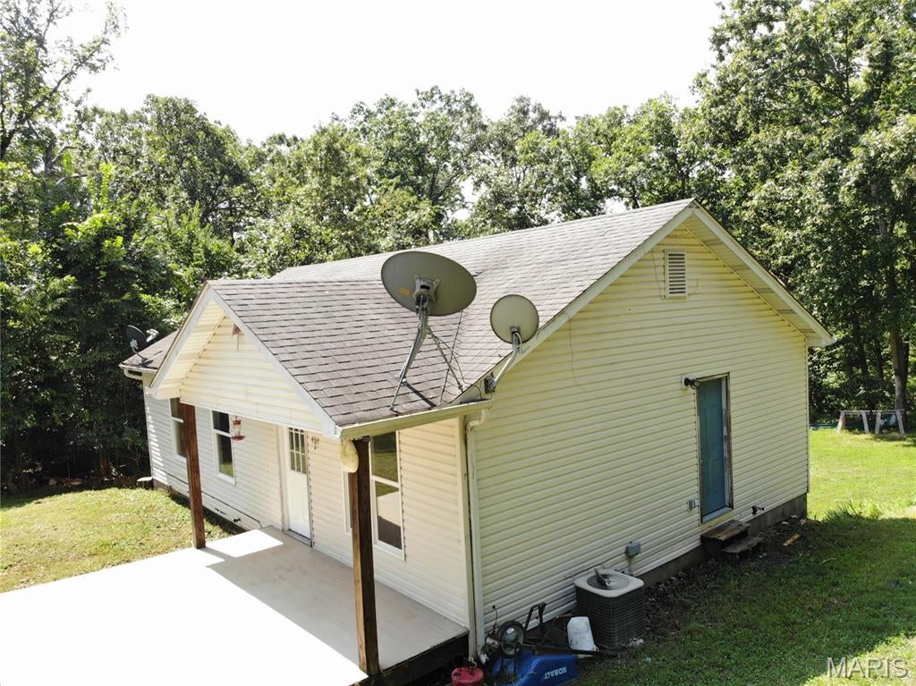 OPPORTUNITY!!  Discover the possibilities on 10.62+/- wooded acres with no association dues or restrictions! This 3-bedroom, 1-bath fixer-upper offers a walk-out basement, a covered porch, and a generous yard surrounded by mature woods and recreational trails. The all-electric home features 200-amp service and offers a great opportunity for renovation, recreation, or the creation of a private country retreat. Bring your tools and vision to unlock this property's potential. Property is being sold "As Is." Buyers and buyers' agents should verify all information and conduct their own due diligence.