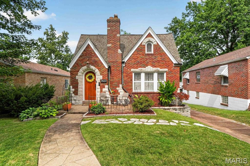 Classic charm, thoughtful updates, and a convenient location near the interstate—what more could you ask for? A classic arched front door with stone accents welcomes you inside, where colorful stained glass and hardwood floors immediately set the tone. The living room features a decorative stone fireplace and flows effortlessly into a flexible adjoining space, perfect for a dining room, playroom, home office, or whatever suits your needs.
The updated kitchen features dark cabinetry, granite countertops, stainless steel appliances, and a breakfast bar that opens to a spacious dining area. Two bedrooms and an updated full bathroom complete the main level.
Upstairs, the spacious primary suite offers a walk-in closet and a stylish en-suite bathroom with an impressive spa shower. Built-in speakers add a fun touch to the second floor—perfect for playing your favorite tunes.
Need storage? The large unfinished basement offers plenty of room with storage closets and open space, plus additional garage space that could serve a variety of uses. Outside, enjoy the fenced-in backyard and an expansive deck with a covered portion and a drop-down movie screen—ideal for relaxing, entertaining, or enjoying a movie night under the stars.
