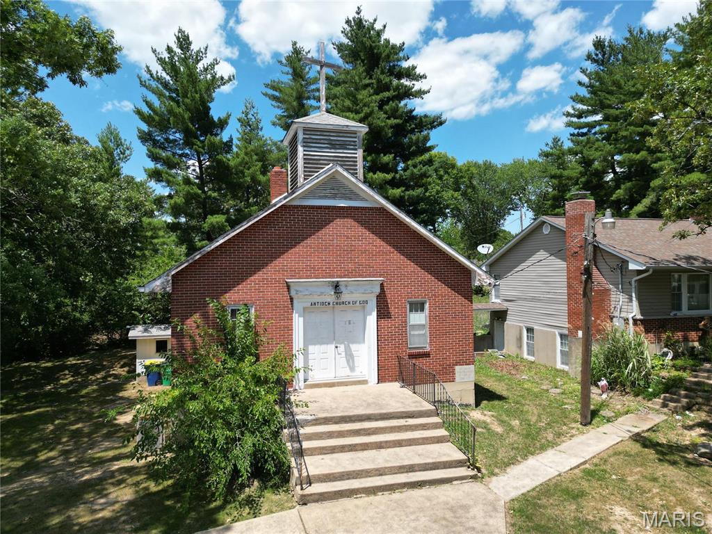 Cherished County Church located within city limits of St. Clair, MO. This charming building hosts a beautiful sanctuary, single stall restroom, and large coat closet on the main level and a worship hall complete with two single stall restroom, kitchen, and office, in the walk out basement. The awe-inspiring timeless brick building is shaded by mature trees.

Don't wait! View this property today! Location: City