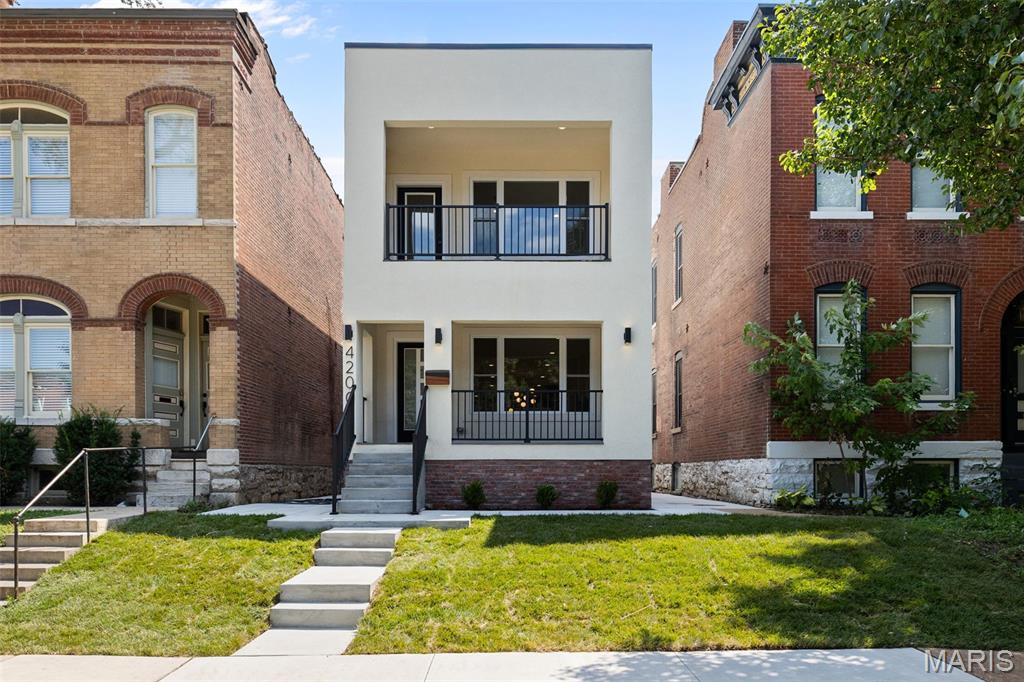 Stunning new construction in the heart of Forest Park Southeast, thoughtfully designed with high-end finishes, modern architecture, and incredible indoor-outdoor living. The main level offers a bright, open, and spacious floor plan with beautiful hardwood flooring, recessed lighting, designer fixtures, and an impressive chef’s kitchen that anchors the home. The kitchen features custom high-end cabinetry, sleek quartz countertops, stainless steel appliances, a large waterfall-style island with seating, stylish pendant lighting, and excellent storage. A dramatic powder room adds a designer touch, while the open living and dining areas create the perfect space for everyday living and entertaining.

Upstairs, you’ll find 3 bedrooms on one level, including a spacious primary suite with a private walk-out balcony overlooking the tree-lined street. The primary suite also features a large walk-in closet with custom built-ins and a beautifully finished bathroom with dual vanity, modern tile, and a glass-enclosed shower. Additional bedrooms are generous in size with great natural light, and the second full bath offers elevated finishes with a clean, modern design.

Enjoy multiple outdoor spaces, including the covered front porch, private upper balcony, rear covered deck with ceiling fan, fenced backyard, and covered parking/carport with alley access. The full basement provides excellent storage or future potential. A rare opportunity to own a brand-new, move-in ready home with luxury finishes, thoughtful design, and an unbeatable Forest Park Southeast location near The Grove, Forest Park, Cortex, BJC/WashU Medical Campus, restaurants, entertainment, and major city conveniences.