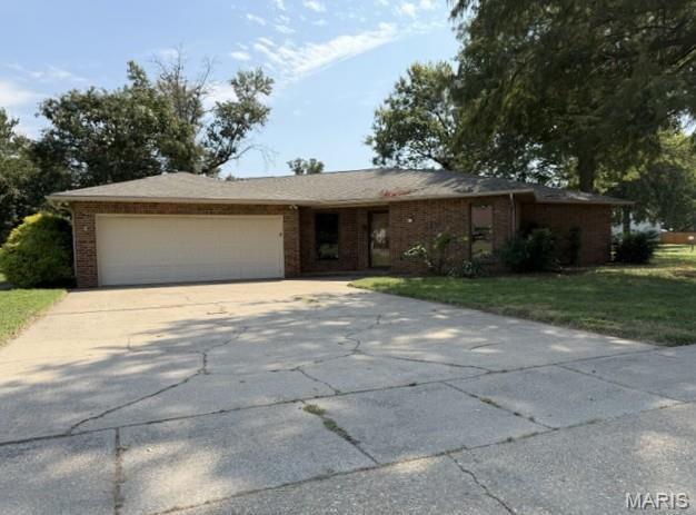 This 3-bedroom, 2-bath home sits on a large corner lot in a desirable, family-friendly neighborhood. Featuring a unique and spacious layout, the home offers custom details throughout, a central vacuum system, and an upgraded kitchen. The brick exterior adds timeless appeal, while the convenient location near schools makes this an ideal home for families.