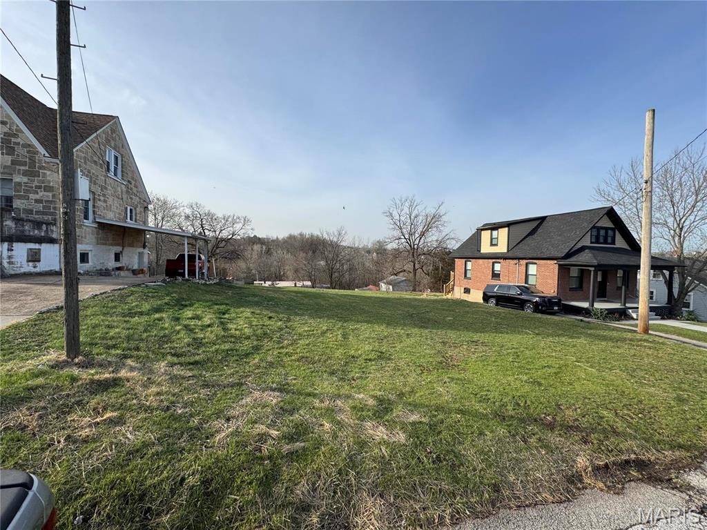 Prime Residential Lot in Historic Hermann, MO!

Nestled in the heart of Missouri Wine Country, this 0.165-acre residential lot offers the perfect opportunity to build your dream home in the charming town of Hermann. The lot is open and ready for development, with city water, sewer, electric, phone, and trash services available—making the building process a breeze.

Enjoy the best of small-town living with wineries, parks, shopping, and dining just minutes away. Whether you're looking to build a permanent residence, a weekend getaway, or an investment property, this lot is ideally situated to enjoy all that Hermann has to offer.

Don’t miss this chance to own a piece of this picturesque town—schedule a visit today!