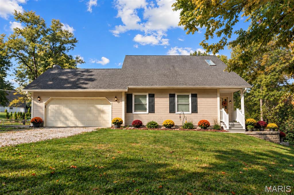 Welcome home to the perfect blend of peaceful country living and modern comfort! Nestled on 4.18 scenic acres in the highly sought-after Washington School District, this impressive 4-bedroom, 3 full bath, 1.5-story home offers privacy, space, and breathtaking views of a neighboring lake—all while providing the convenience of a move-in ready home with extensive updates.

Step inside to an inviting open-concept floor plan featuring luxury vinyl plank flooring throughout the main living areas and a stunning shiplap feature wall showcasing a cozy electric fireplace. Take in serene views with all the living room windows letting in natural light. The spacious kitchen is designed for both everyday living and entertaining with a center island offering seating, double sink, dedicated coffee bar station, abundant cabinetry, and easy access to the expansive 40-foot composite deck overlooking the picturesque countryside.

The oversized primary suite is a true retreat with a large walk-in closet and private ensuite bath. A second main floor bedroom, currently utilized as a home office, provides flexibility for guests or work-from-home needs. An updated full bathroom with walk-in shower and convenient main floor laundry complete the main level.

Upstairs you'll find two enormous bedrooms, each featuring walk-in closets, along with a charming bonus playroom that also makes an excellent craft room, reading nook, or additional storage space. A third full bath completes the upper level.

The finished walkout lower level offers exceptional additional living space with an expansive family room, dedicated finished office/flex room (ideal for a home office, hobby room, workout space, or safe room), plus a separate unfinished room ready to become the perfect media or movie room. The oversized storage and utility area provides incredible functionality, and future bathroom addition in lower level is made easy with a ready framed, exterior-drywalled bathroom complete with rough-in plumbing ready for your finishing touches.

Outside, enjoy the beauty of nature from the covered patio featuring built-in privacy screens, or relax on the expansive composite deck while taking in peaceful lake views of neighboring property.  The fenced yard features 8ft gate entrance for easy access, mature shade trees, wooded backdrop, wet-weather creek, lean-to storage conveniently located on side of home, and abundant wildlife create your own private country oasis.

Recent improvements include all new windows (2025), two new double sliding patio doors, new sump pump, luxury vinyl plank flooring, and gutter guards. If you're looking for acreage, privacy, Washington Schools, and a home with room to grow, this exceptional property is one you won't want to miss. Minimal restrictions to protect your investment.
SELLER INCENTIVE! Seller is offering $5,000 toward Buyer’s closing costs and/or interest-rate buydown with an acceptable offer. PLUS, qualified buyers who choose Seller’s preferred lender may receive an additional lender credit equal to 1% of the loan amount, subject to lender terms, loan program and Buyer qualification.