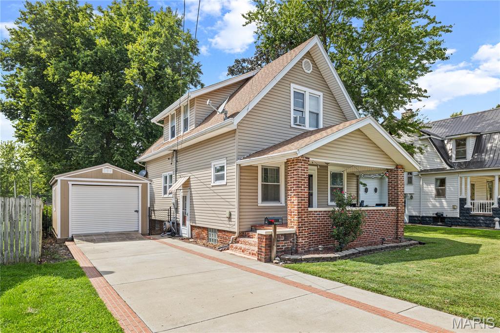 CHARM, UPDATES, & PLENTY OF OUTDOOR SPACE! This 3 bedroom, 1.5 bath home is situated on a spacious double lot and offers a great blend of original character and modern updates. Step inside to an inviting living room with built-ins, a formal dining room, renovated kitchen, and large main-floor laundry room. The upstairs full bathroom has also been beautifully renovated. Recent improvements include a new rear wood deck completed in summer 2026, a new sump pump in 2026, new laminate flooring in 2025, blown-in attic insulation in 2025, hot water heater in 2025, and backyard fencing in 2024. Woods Basement Systems has also completed waterproofing improvements for added peace of mind. Start your mornings with a cup of coffee while watching the sunrise from the east-facing front porch, then unwind in the evenings and catch the sunset from the west-facing back deck. Outside, the double lot provides plenty of room to enjoy, with the yard extending all the way to North Adams Street. A large shed along the concrete driveway can accommodate a small vehicle, while an additional backyard shed provides extra storage and has potential to be transformed into a fun backyard hangout, hobby space, or workshop. Conveniently located just a few blocks from the schools, this charming home offers plenty of space, character, and many of the updates you've been looking for!