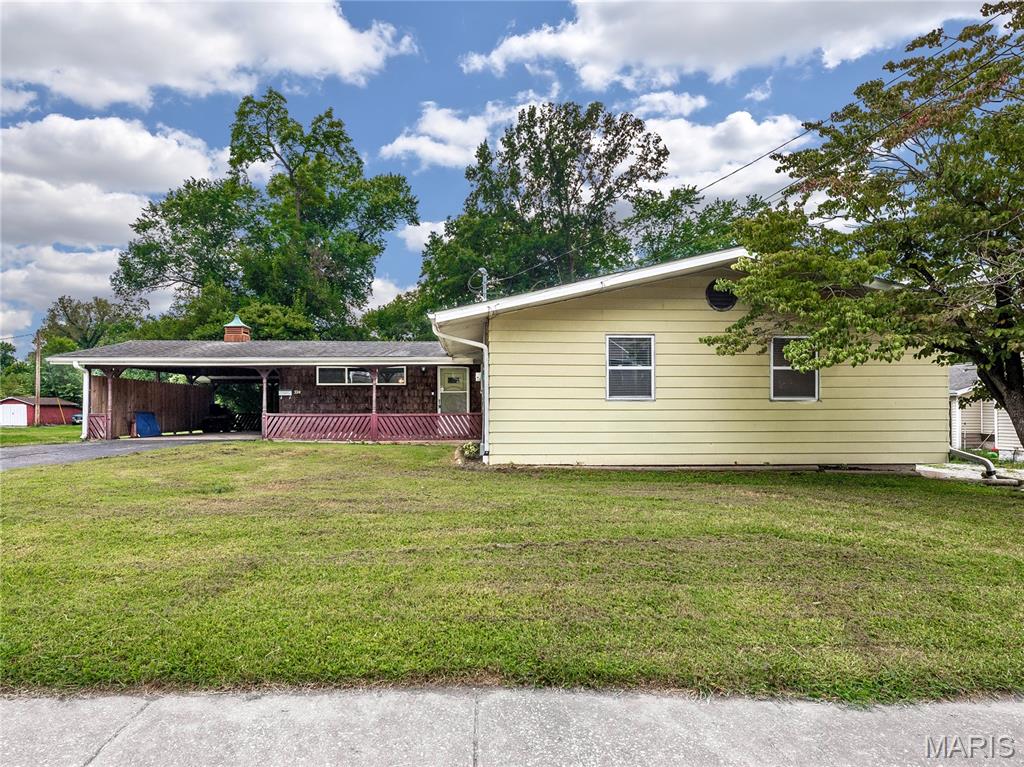 At over 1500 square feet of above-ground, finished living space, this home offers large rooms, newer flooring, and pleasant interior finishes. The property features a charming, covered rear deck, and a very deep, .97-acre parcel with a fenced back yard. There's also a full, unfinished, walkout basement just waiting to become additional living space. This property is well on its way to meeting its full potential, and has passed Caseyville occupancy inspection. It is being sold in AS IS condition: the basement takes on water after heavy rainfall, and the rear deck requires work.  Showings begin on Thursday, August 13th. See this property soon! Buyer to verify all MLS data including but not limited to square feet, measurements, features, exemptions/taxes, schools, etc.