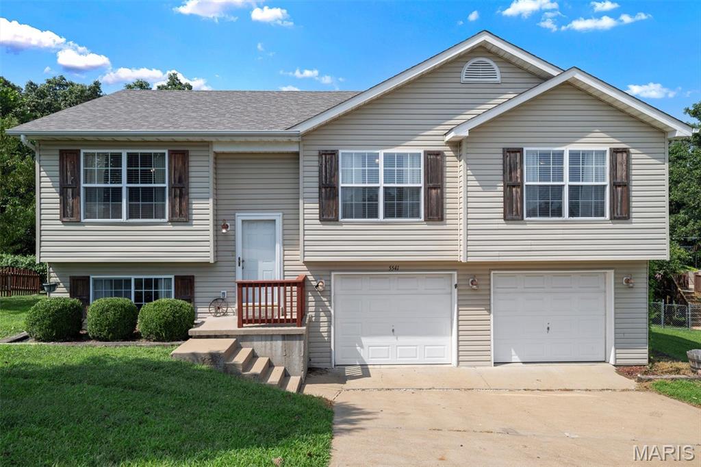 Welcome to this inviting 3-bedroom, 2.5-bath split-level home in the Pine View Acres neighborhood of House Springs! The main level offers a spacious and functional layout featuring three bedrooms, two full bathrooms, and a separate dining area perfect for everyday meals or entertaining. The primary suite includes a private full bath with a walk-in shower for added convenience. The finished lower level provides additional living space with a comfortable family room, half bath, and dedicated laundry area. Enjoy easy access to the backyard deck, ideal for relaxing or entertaining outdoors. A two-car attached tuck-under garage provides convenient parking and additional storage. With a versatile floor plan and plenty of living space, this home is ready for you to make it your own!