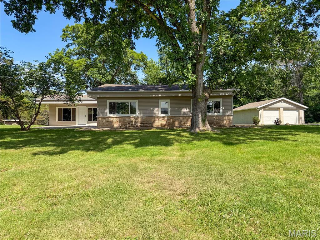 Charming 3-bedroom, 1-bath ranch home situated on 2.96 peaceful acres in the DeSoto School District! Nestled along Highway 21, this private setting offers the perfect blend of convenience and country living. This spacious home features an open floor plan with the kitchen, dining, and living areas flowing together perfectly for everyday living and entertaining. Large windows throughout fill the home with beautiful natural sunlight. Enjoy relaxing on the spacious front patio overlooking the mature trees that provide shade and privacy in both the front and back yards.

The property offers plenty of space for a garden, animals, outdoor activities, and family fun with no known restrictions beyond Jefferson County guidelines. Conveniently located on Highway 21, just minutes from shopping, dining, and Washington State Park featuring a swimming pool and access to the Big River. Additional features include a 2-car detached garage, private well, and private septic system. A wonderful opportunity to enjoy peaceful country living with convenience nearby! Peaceful country atmosphere with room to roam and grow.
