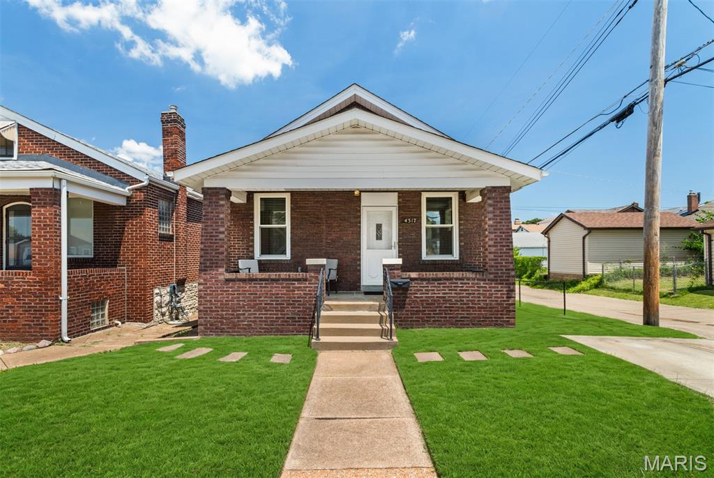 Priced to sell! This charming, move-in-ready South City bungalow offers the perfect blend of character, comfort, and convenience. The well-maintained home features an updated kitchen with granite countertops, stainless steel appliances including refrigerator, and abundant cabinet space. Beautiful hardwood and tile flooring add warmth and timeless appeal throughout.

Enjoy the level, fenced backyard with a patio—ideal for relaxing, entertaining, or accommodating pets. Parking is a breeze with both an attached garage and an additional private parking pad. The washer and dryer are included, making your move even easier.

Major updates completed during the current ownership include a new HVAC system (2021) and main-floor windows, while the roof was replaced in 2014 for added peace of mind.

Located within walking distance of local restaurants, shopping, Carondelet Park, and the St. Louis Greenway, this home combines everyday convenience with a vibrant neighborhood setting. Don't miss this fantastic opportunity to own a beautifully maintained South City home at an exceptional value!